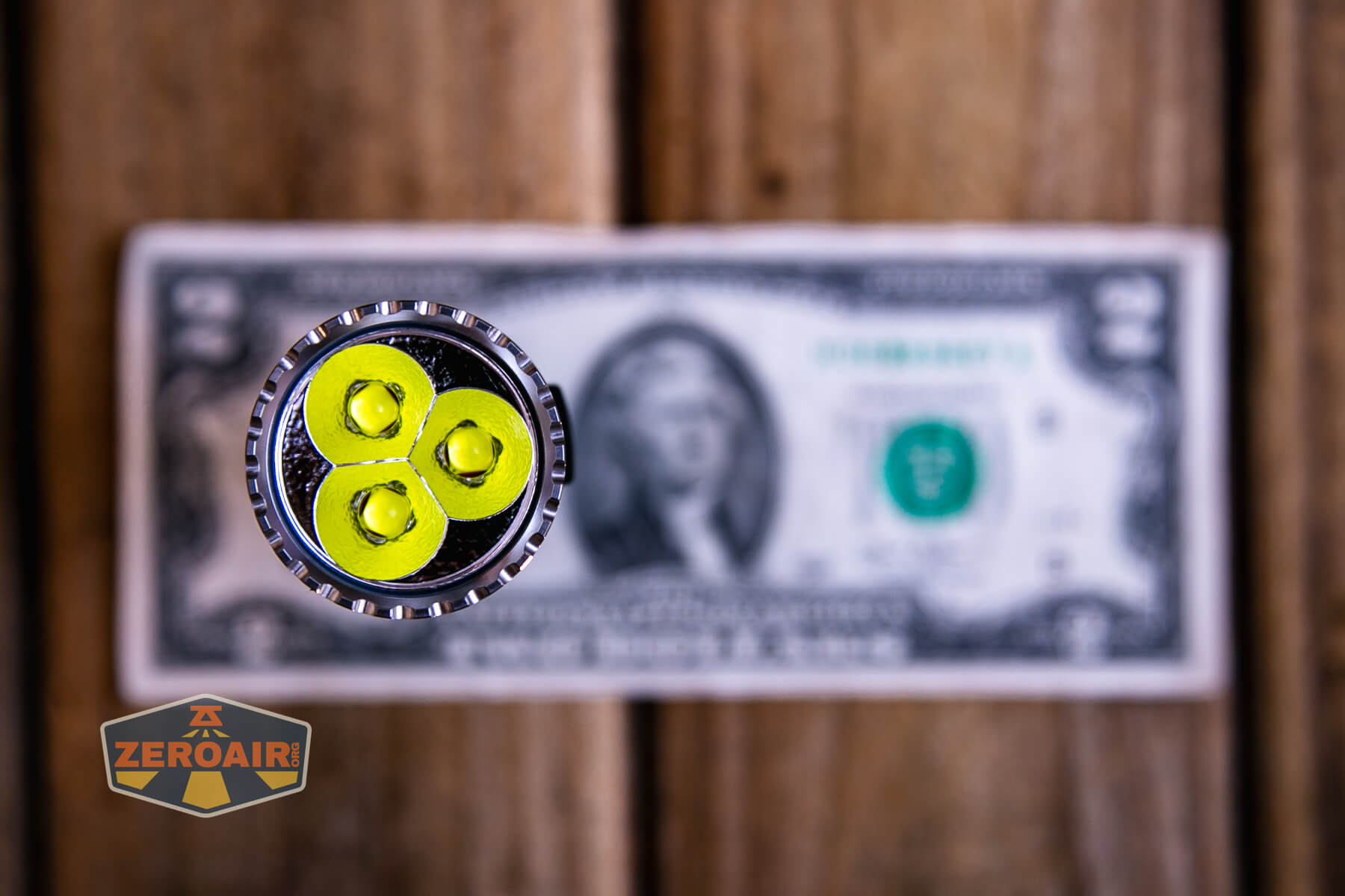 Ripsshine OF1 flashlight on a two dollar bill