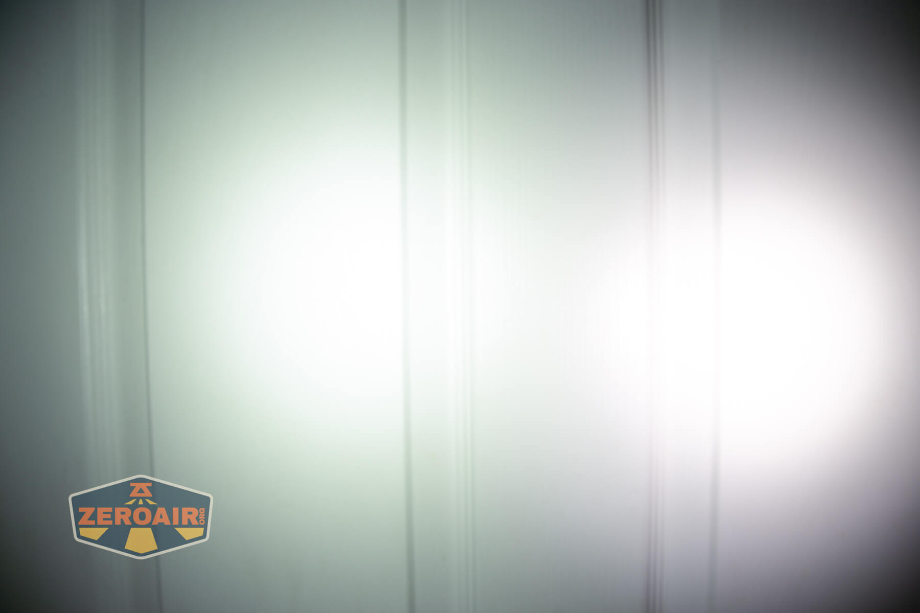 Ripsshine OF1 flashlight beamshots on door (at 1') compared to nichia 219b 4500K