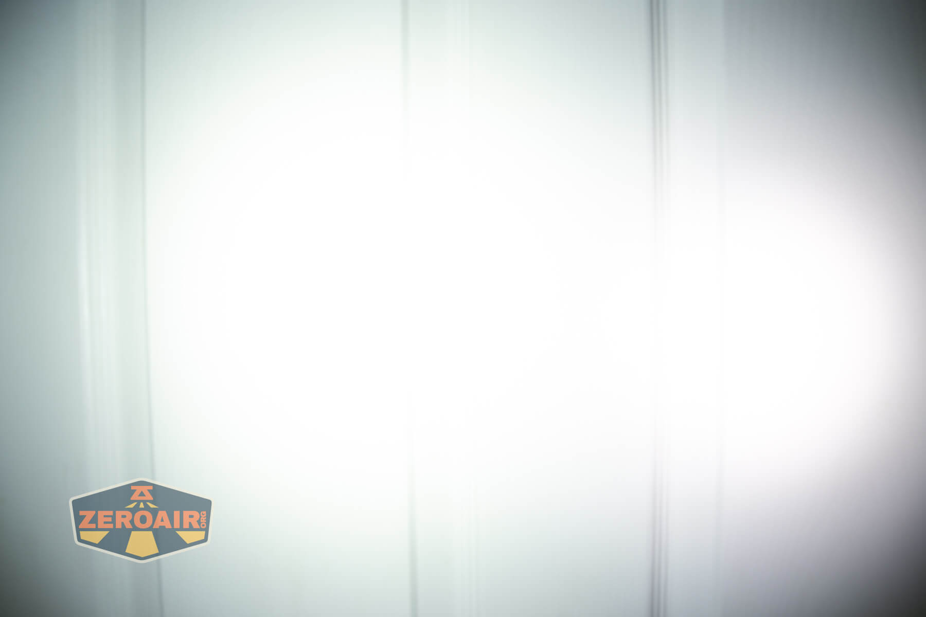 Ripsshine OF1 flashlight beamshots on door (at 1') compared to nichia 219b 4500K