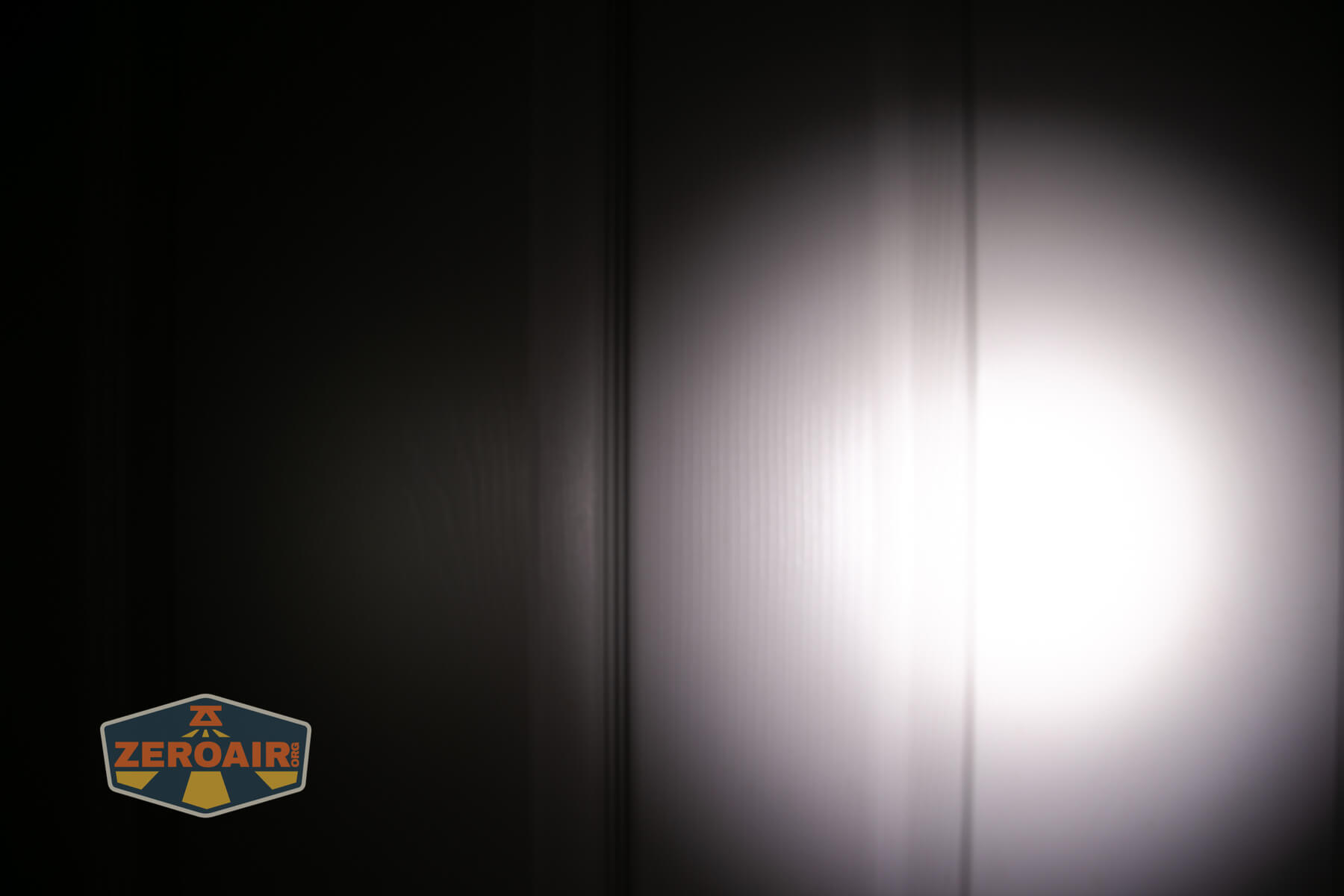 Skilhunt H300R v4 headlamp beamshots on door compared to nichia 219b