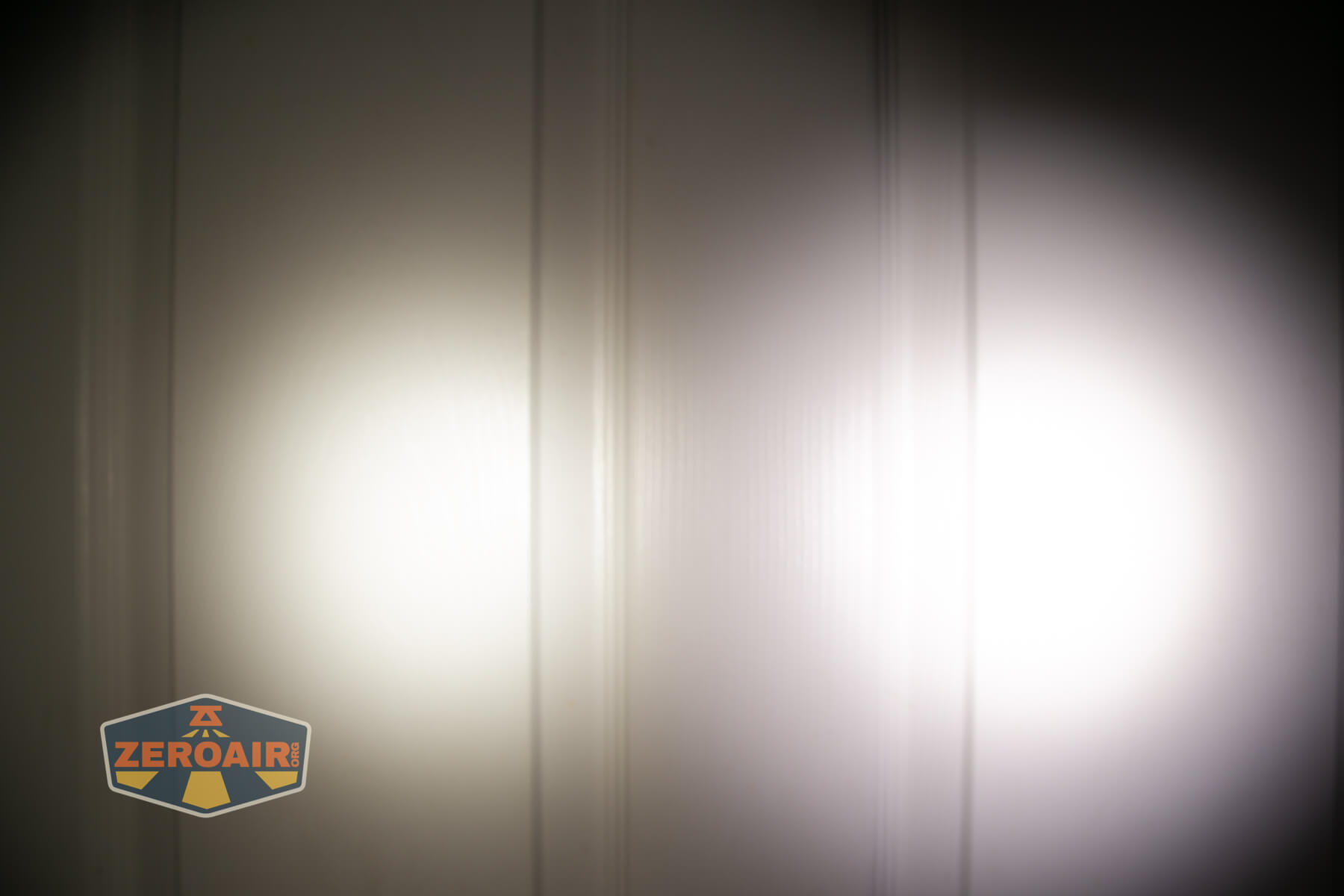 Skilhunt H300R v4 headlamp beamshots on door compared to nichia 219b