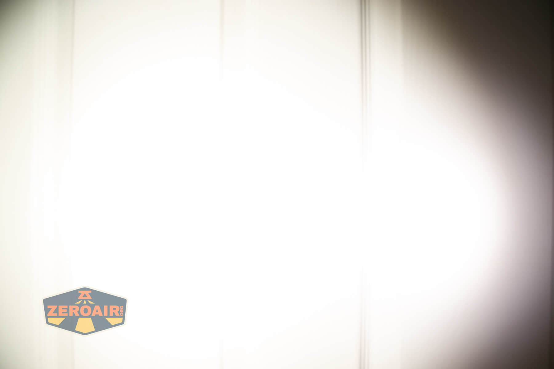 Skilhunt H300R v4 headlamp beamshots on door compared to nichia 219b