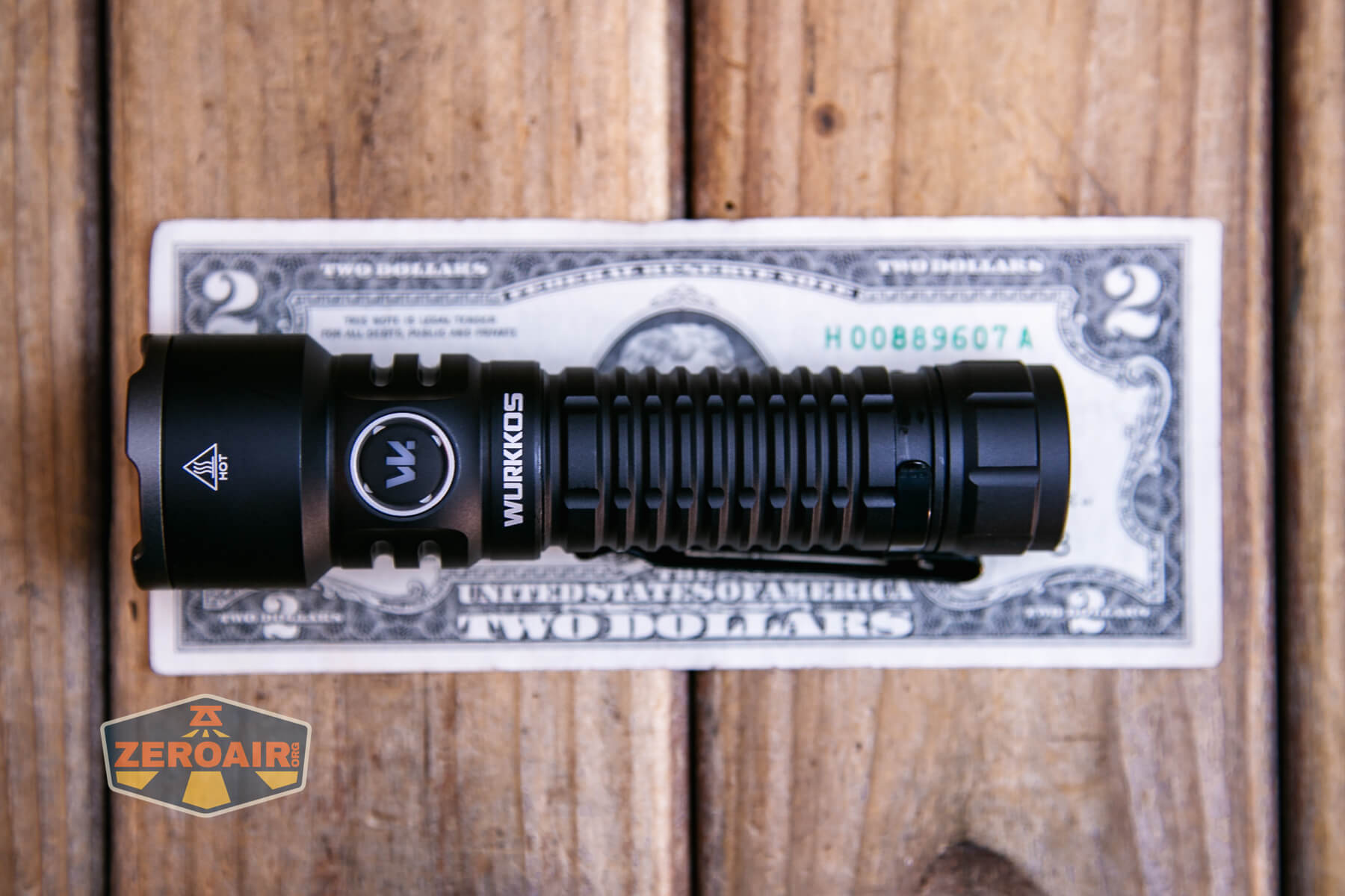 Wurkkos TS28 flashlight on a two dollar bill