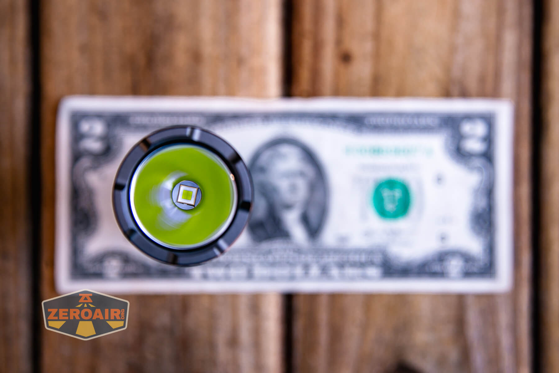 Wurkkos TS28 flashlight on a two dollar bill