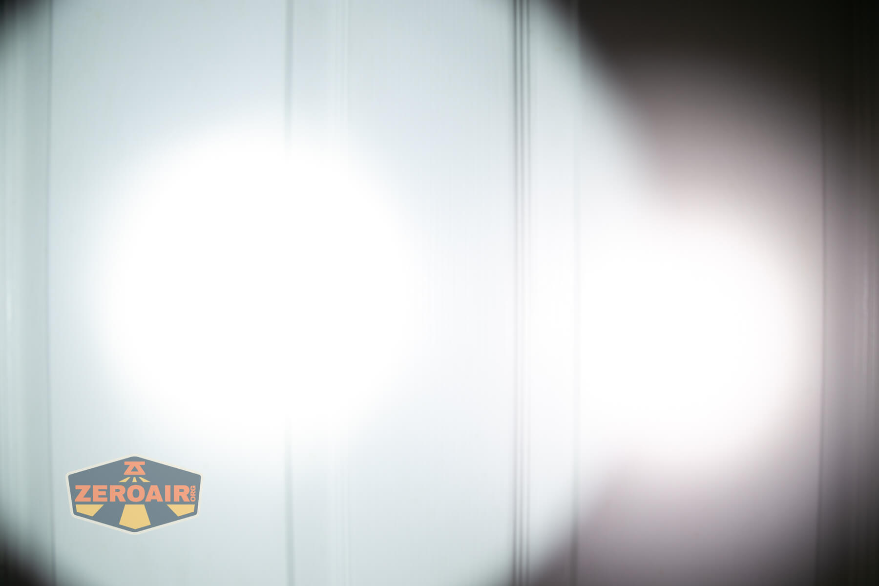 Wurkkos TS28 flashlight beamshots on door (at 1') compared to nichia 219b 4500K