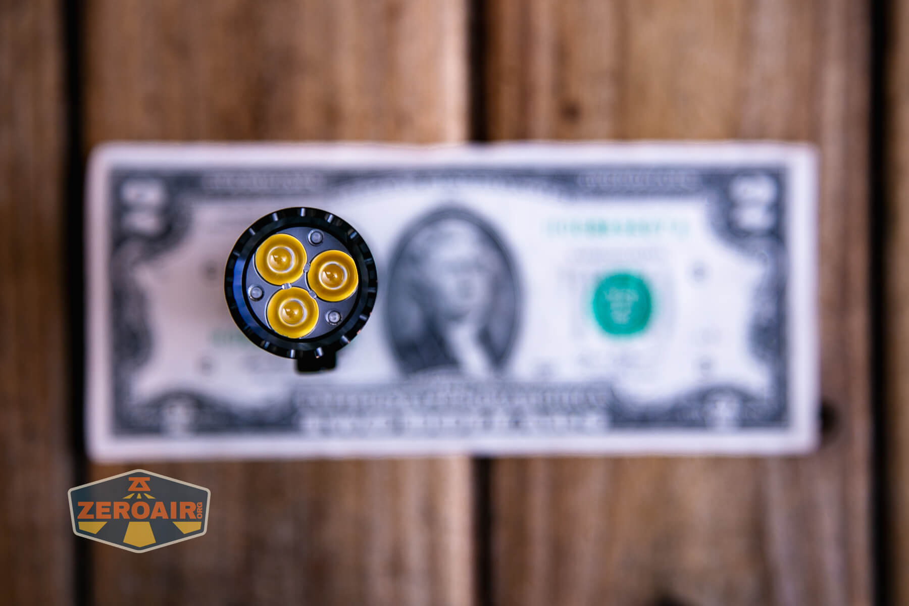 Acebeam EC20 multi-light source edc flashlight on a two dollar bill