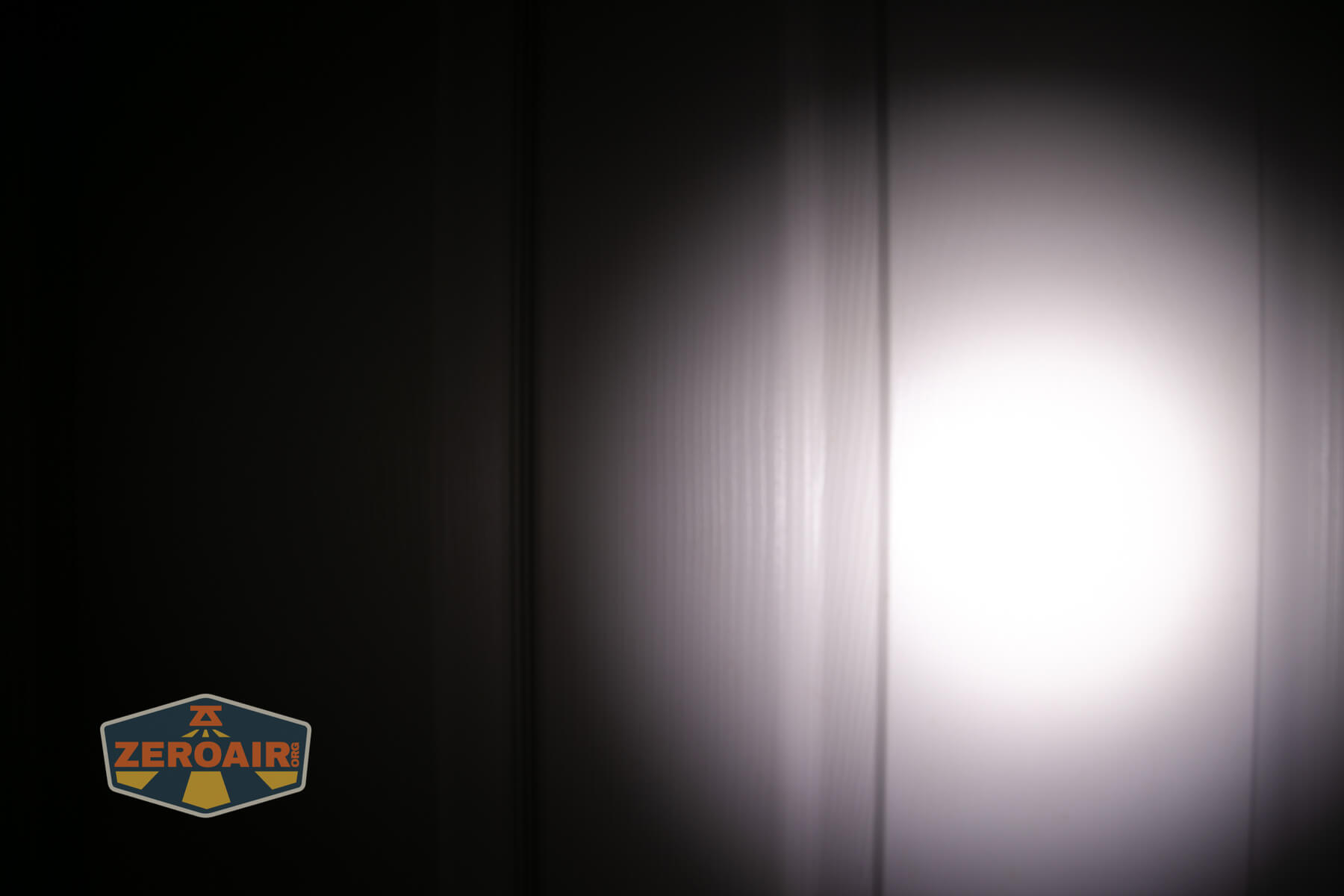 Acebeam EC20 multi-light source edc flashlight beamshots on door (at 1') compared to nichia 219b 4500K