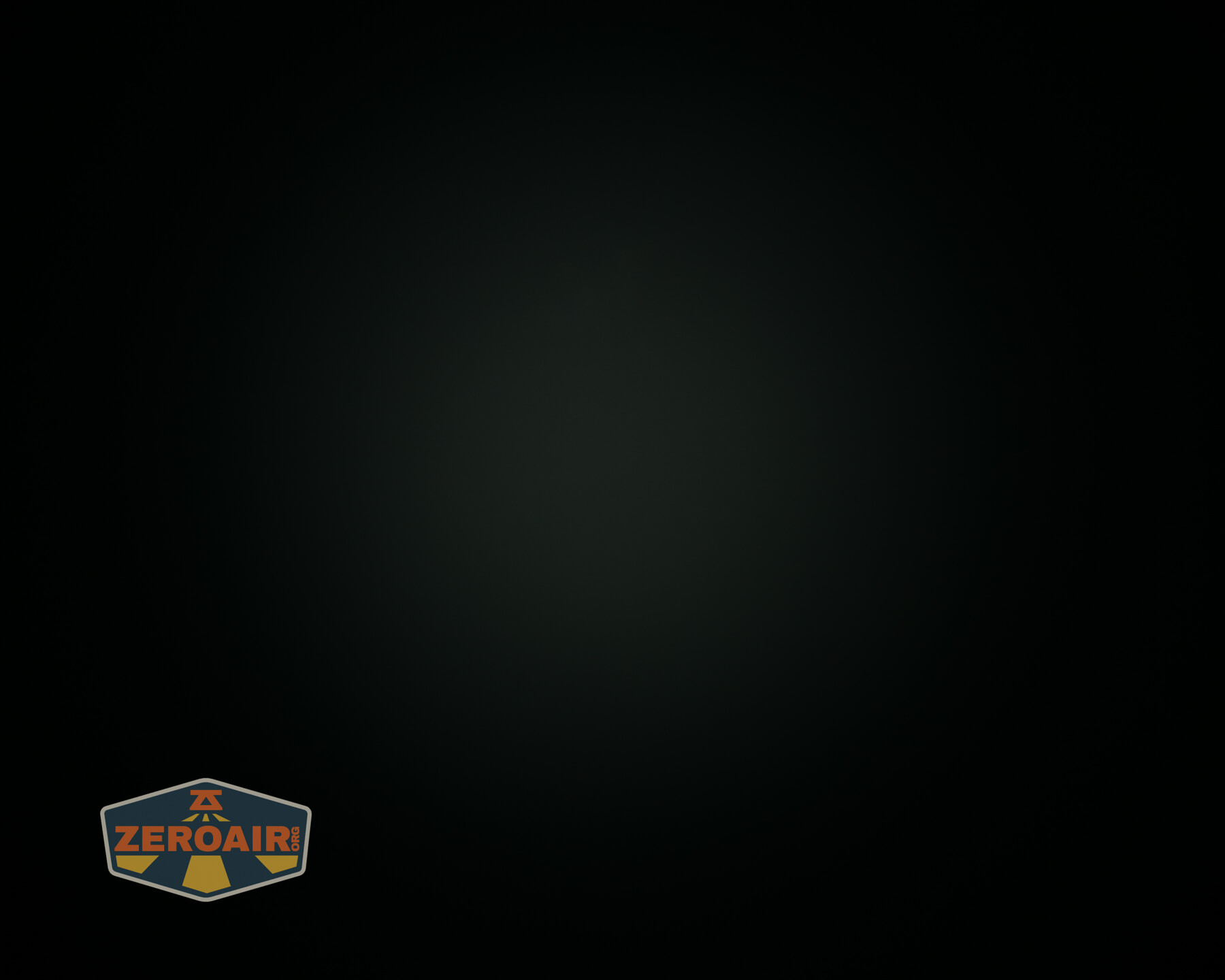 A mostly black image with a faint dark center. In the bottom left corner, there is a logo with the word ZEROAIR on it. No other objects or details are visible.
