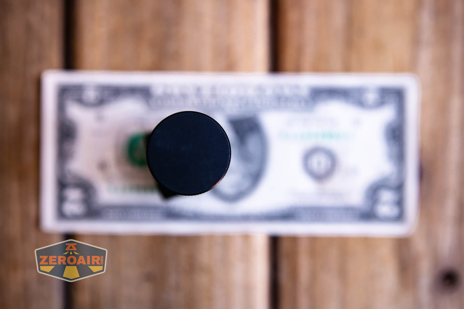 Sofirn HS43 headlamp on a two dollar bill