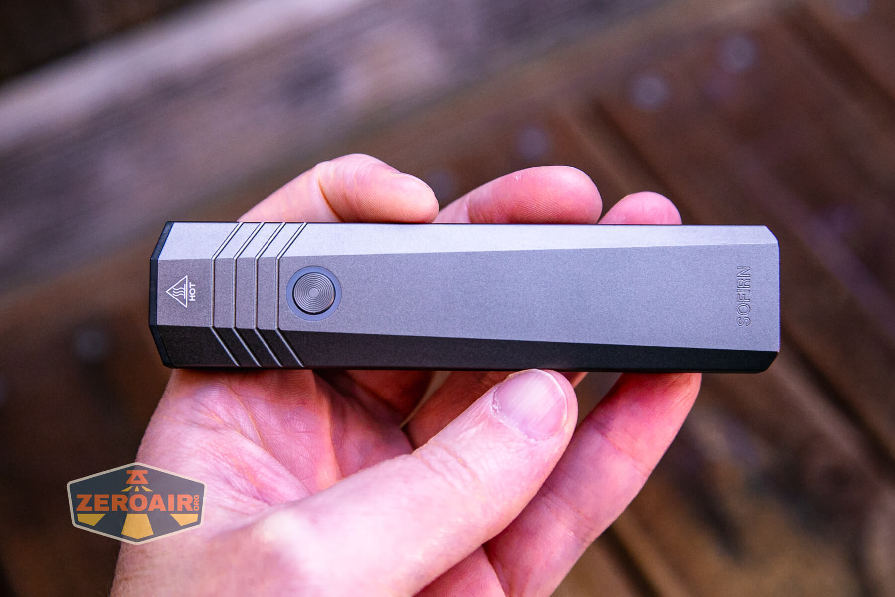 SOFIRN ST1 rechargeable flat EDC flashlight in hand