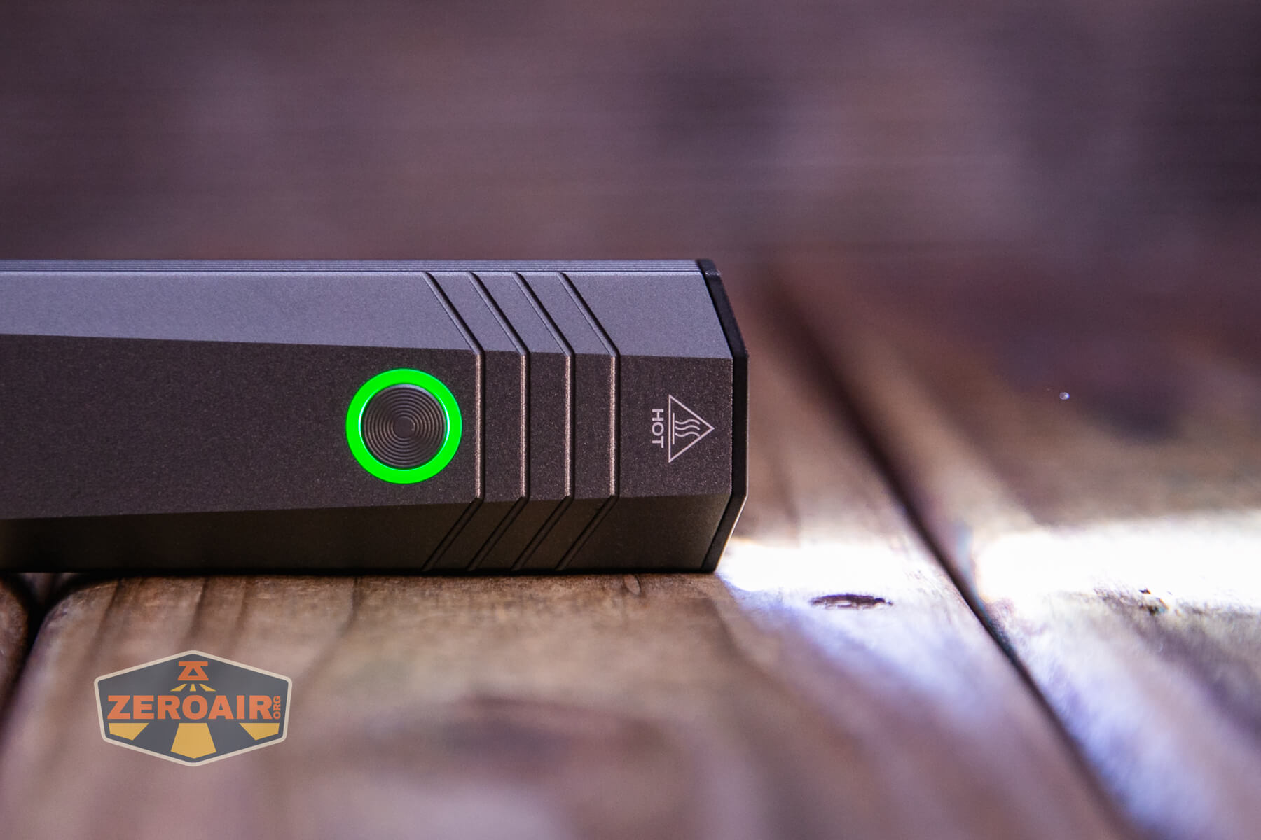 SOFIRN ST1 rechargeable flat EDC flashlight switch lit in green