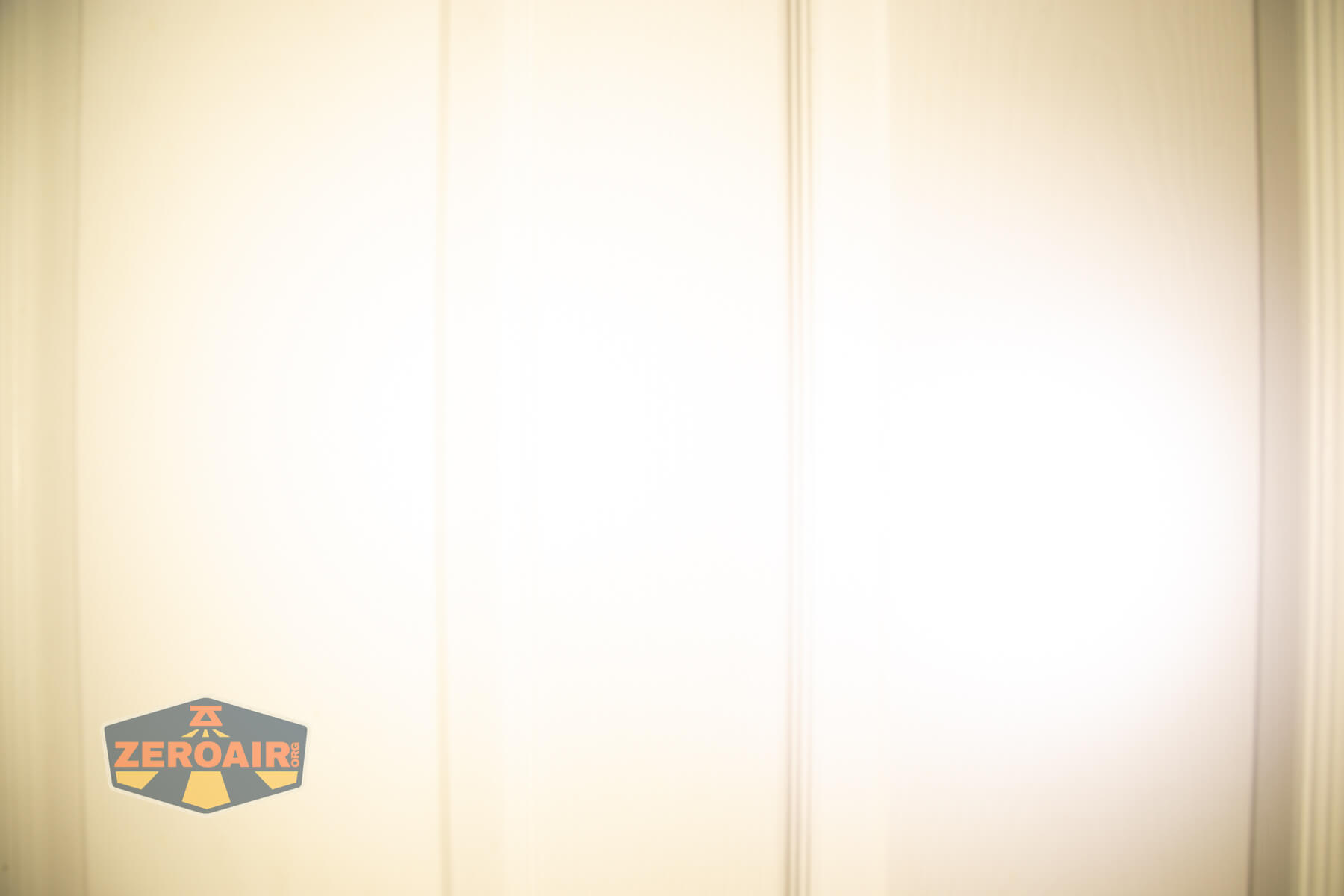 Wuben H4 Multi-function headlight beamshots on door compared to nichia 219b