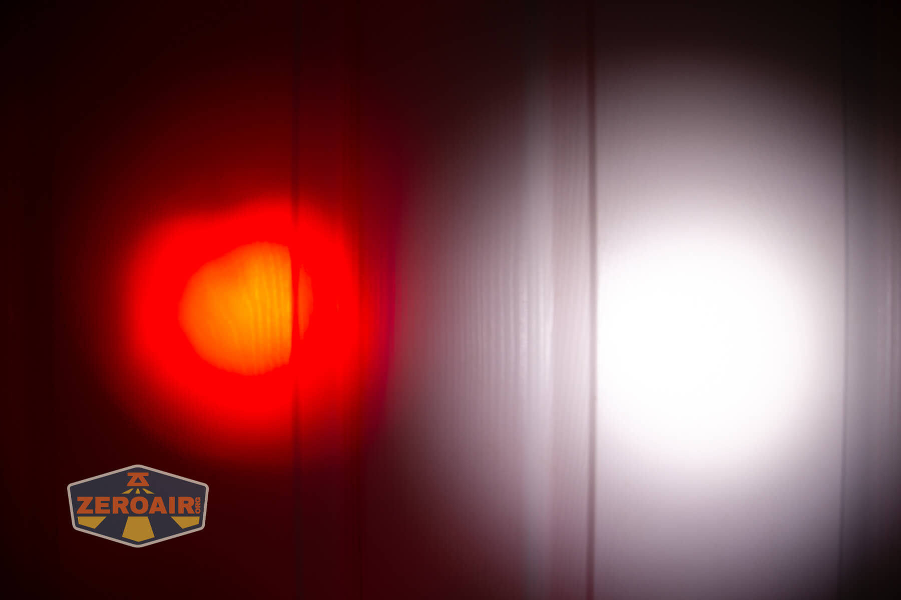 Wuben H4 Multi-function headlight beamshots on door compared to nichia 219b