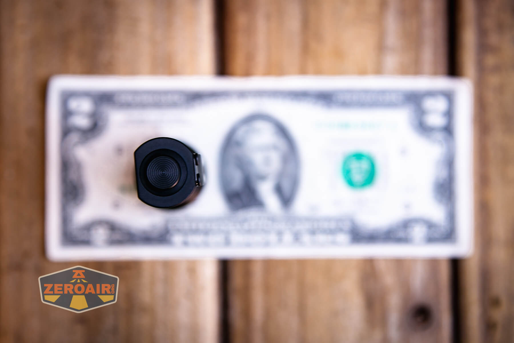 Acebeam K1 EDC flashlight on a two dollar bill