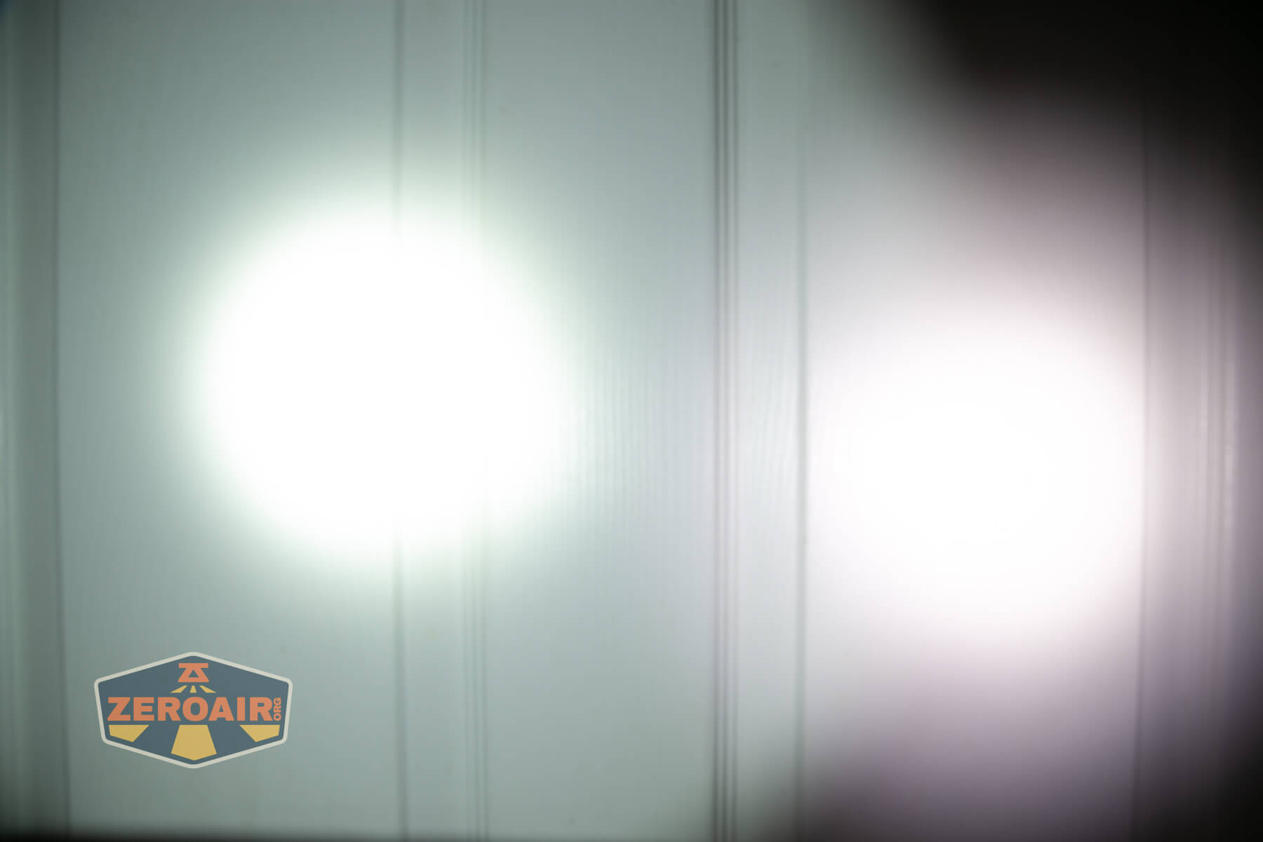 Acebeam K1 EDC flashlight beamshots on door (at 1') compared to nichia 219b 4500K