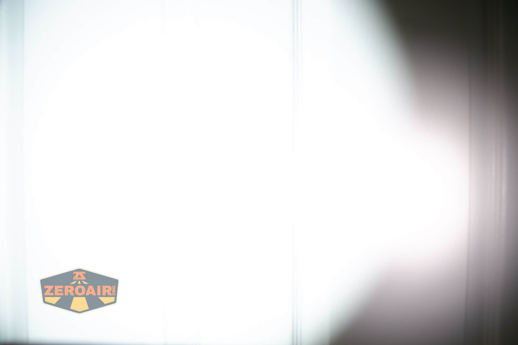 Acebeam K1 EDC flashlight beamshots on door (at 1') compared to nichia 219b 4500K