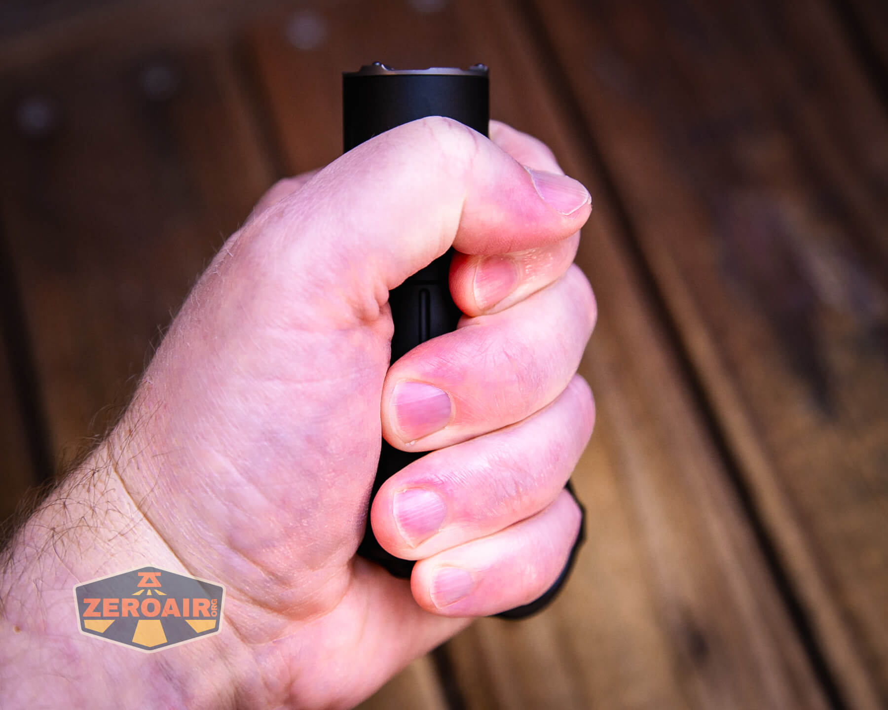 Nextorch Artorch compact EDC tactical flashlight in hand