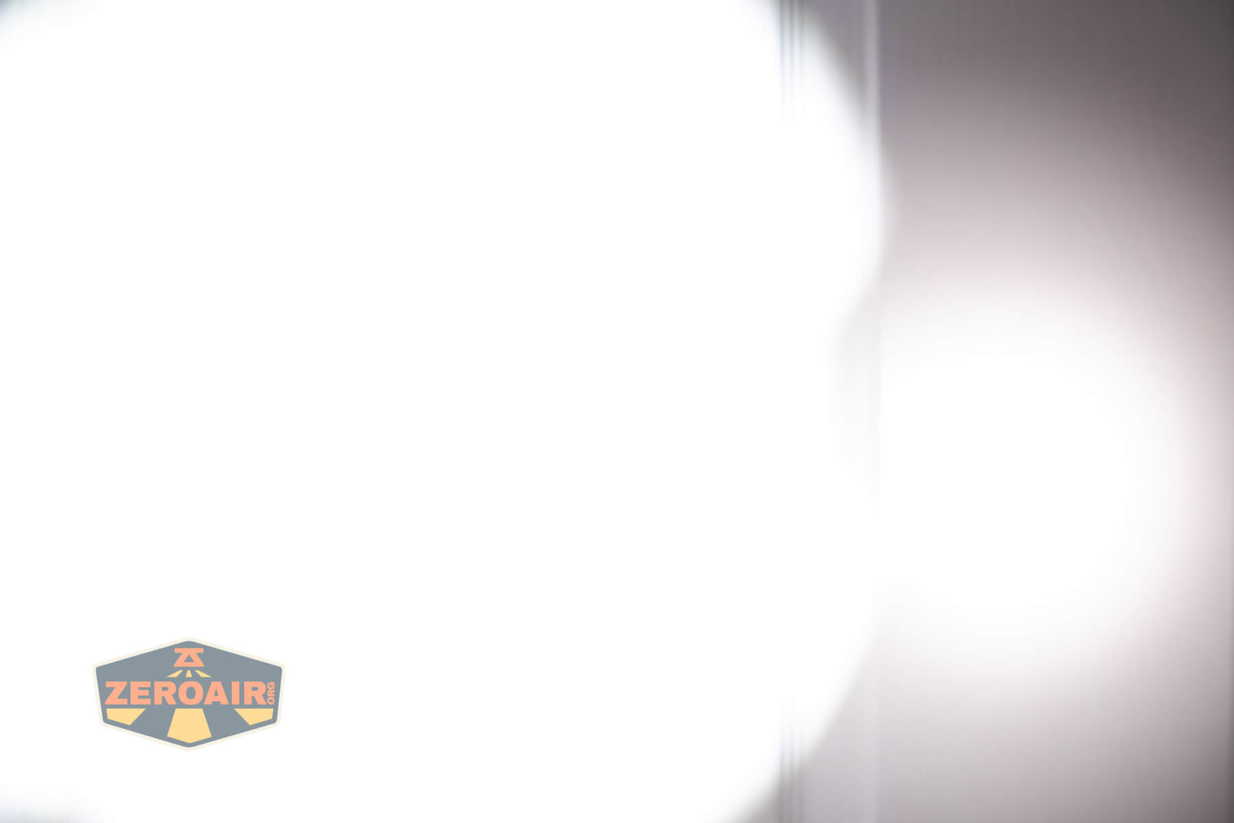 Nextorch Artorch compact EDC tactical flashlight beamshots on door (at 1') compared to nichia 219b 4500K