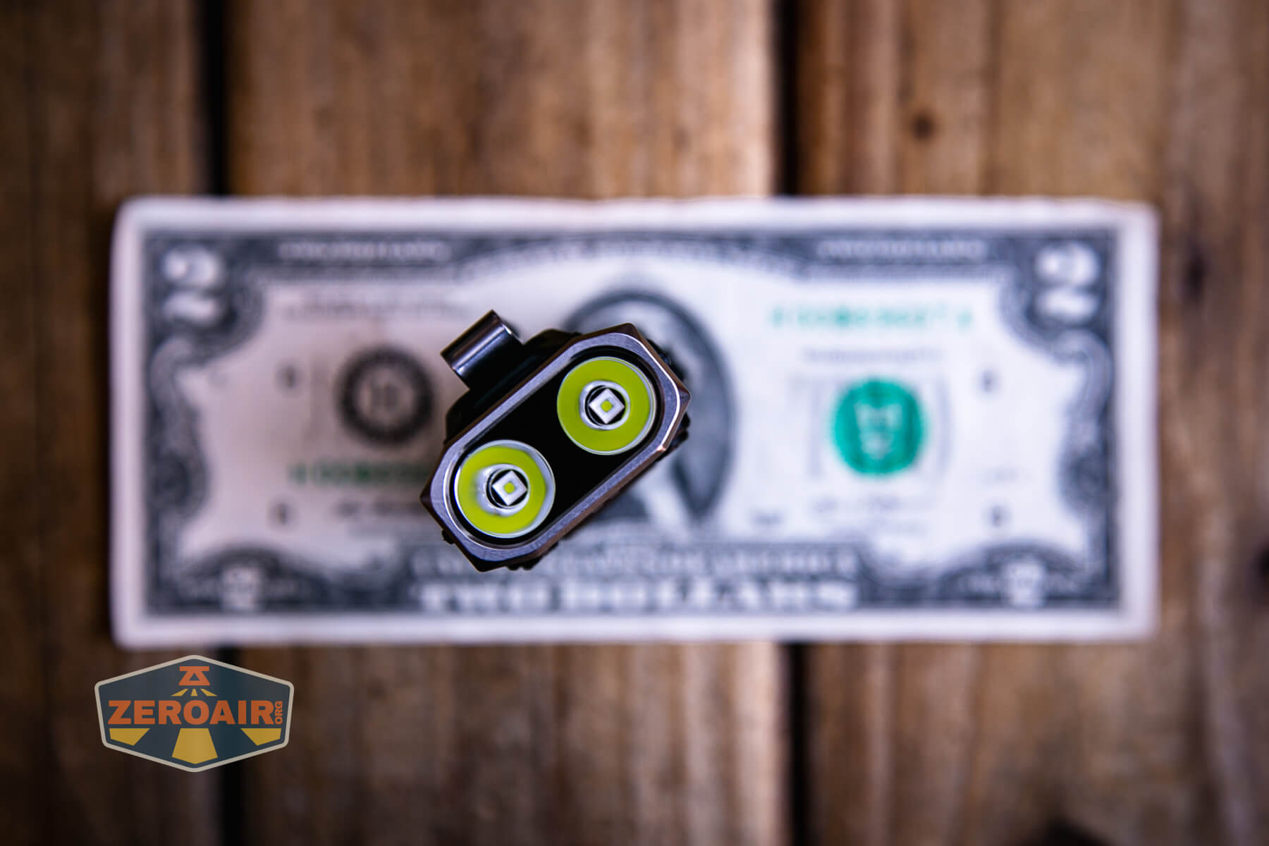 RovyVon E10 Pro flashlight on two-dollar bill