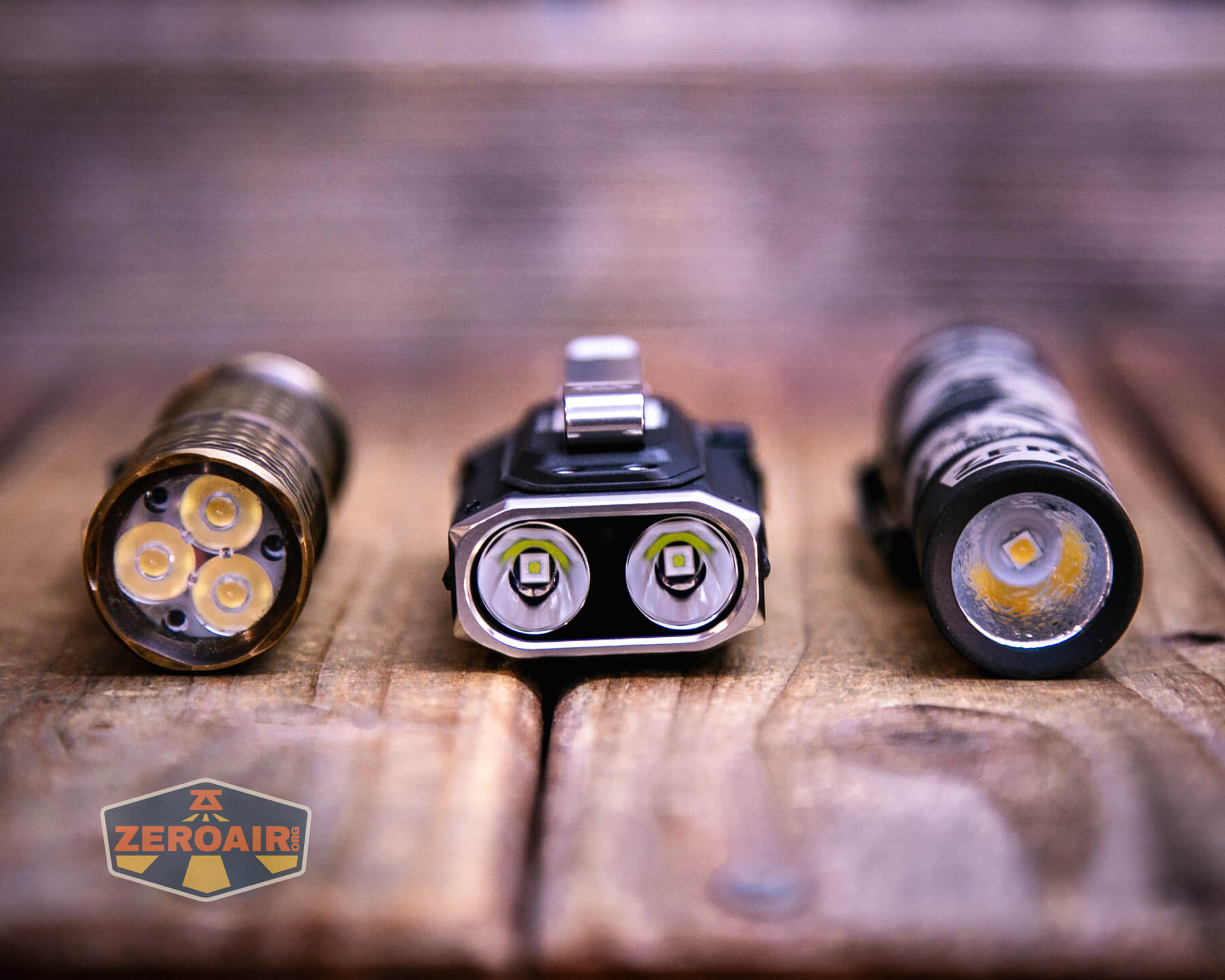 RovyVon E10 Pro flashlight with two standard-sized flashlights