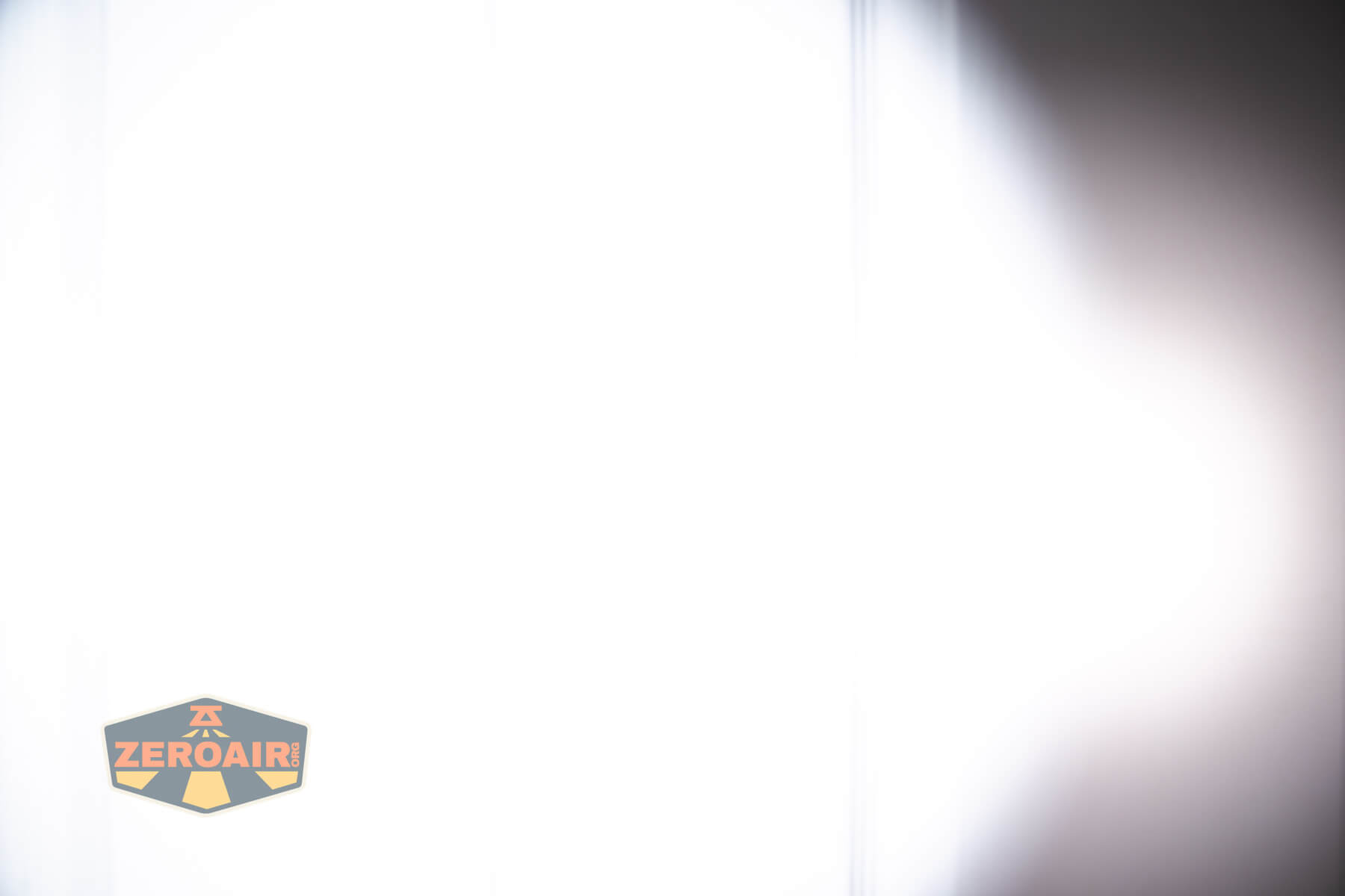 RovyVon E10 Pro flashlight beamshots on door compared to nichia 219b