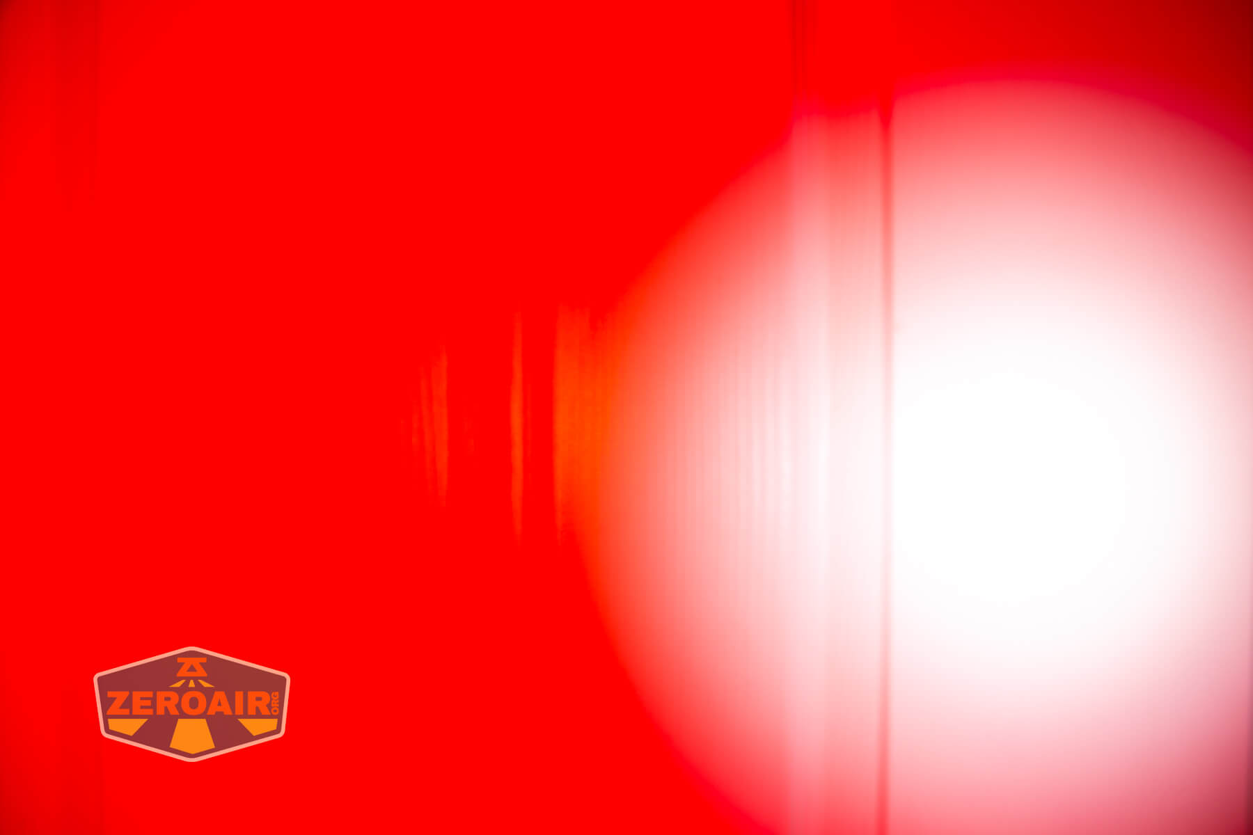 RovyVon E10 Pro flashlight beamshots on door compared to nichia 219b