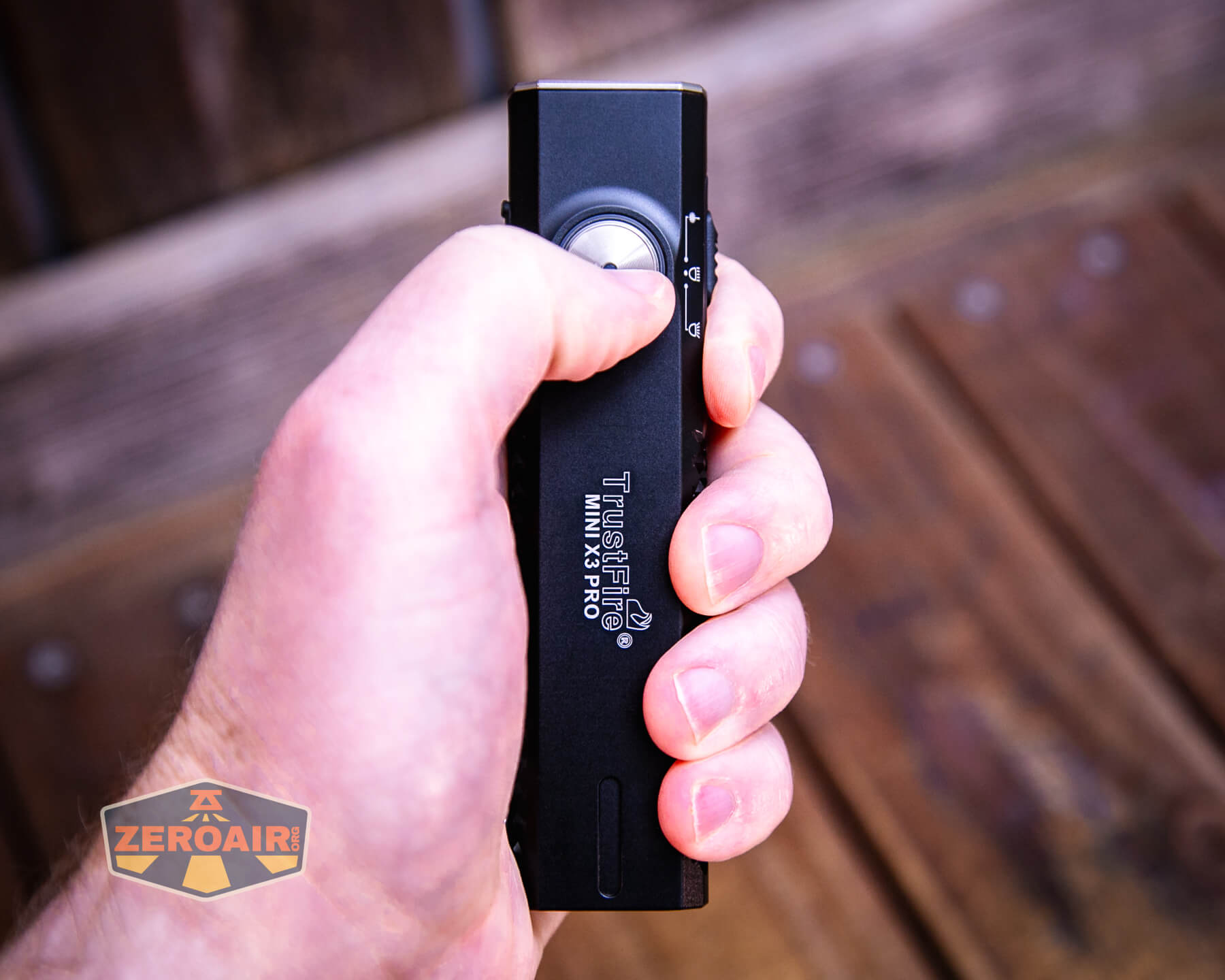 Trustfire Mini X3 Pro EDC multi-function flashlight in hand