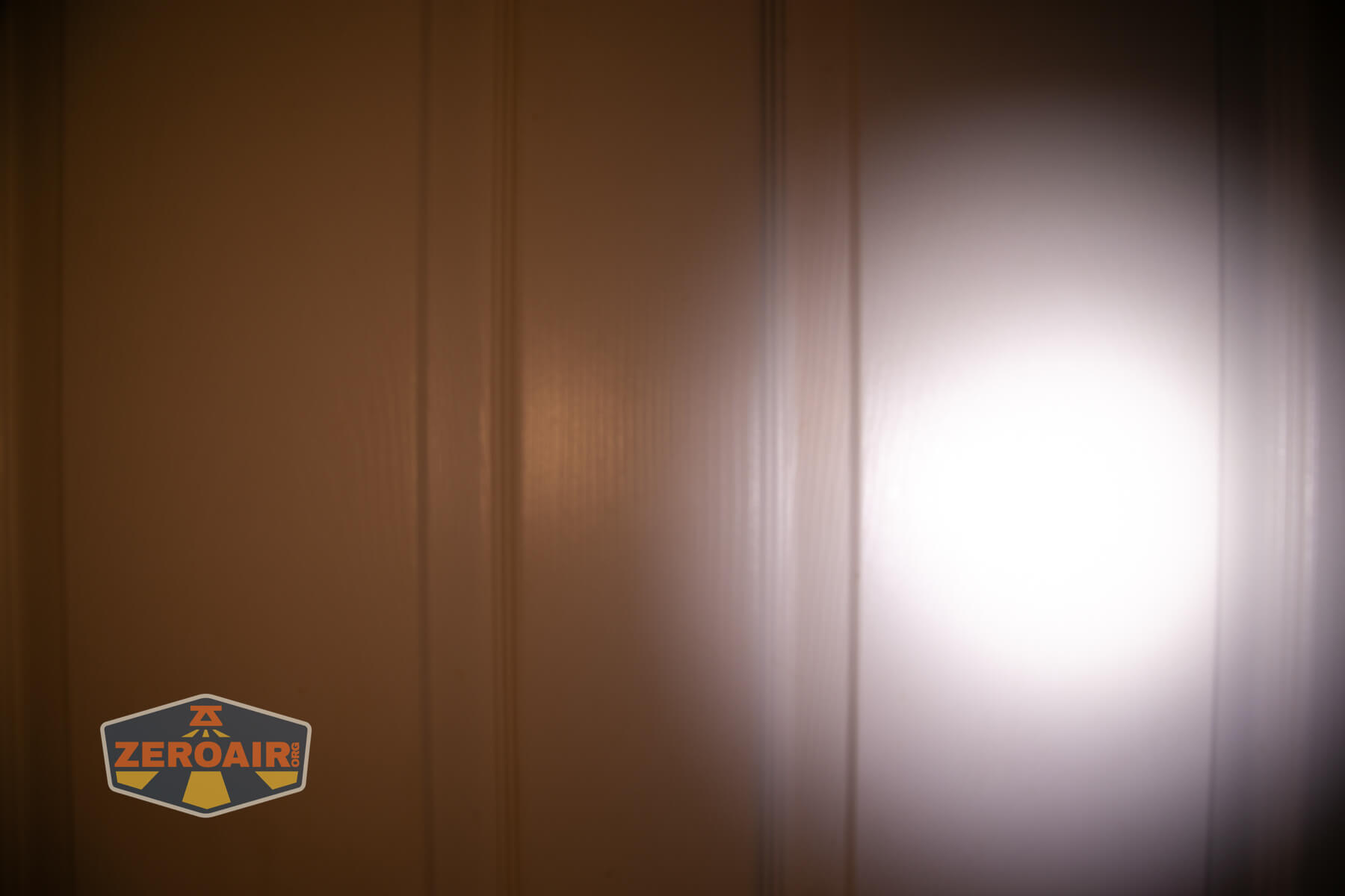 Trustfire Mini X3 Pro EDC multi-function flashlight beamshots on door (at 1') compared to nichia 219b 4500K