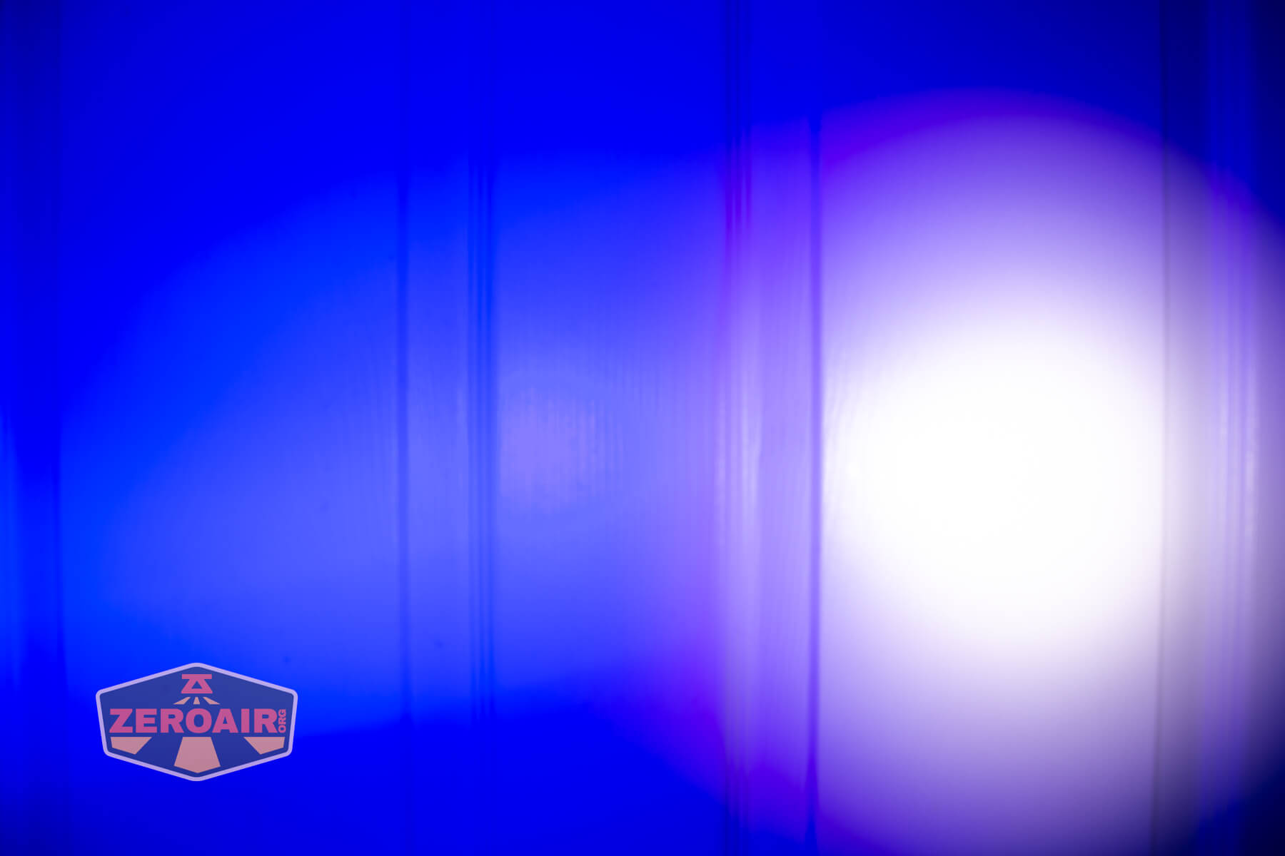 Trustfire Mini X3 Pro EDC multi-function flashlight beamshots on door (at 1') compared to nichia 219b 4500K