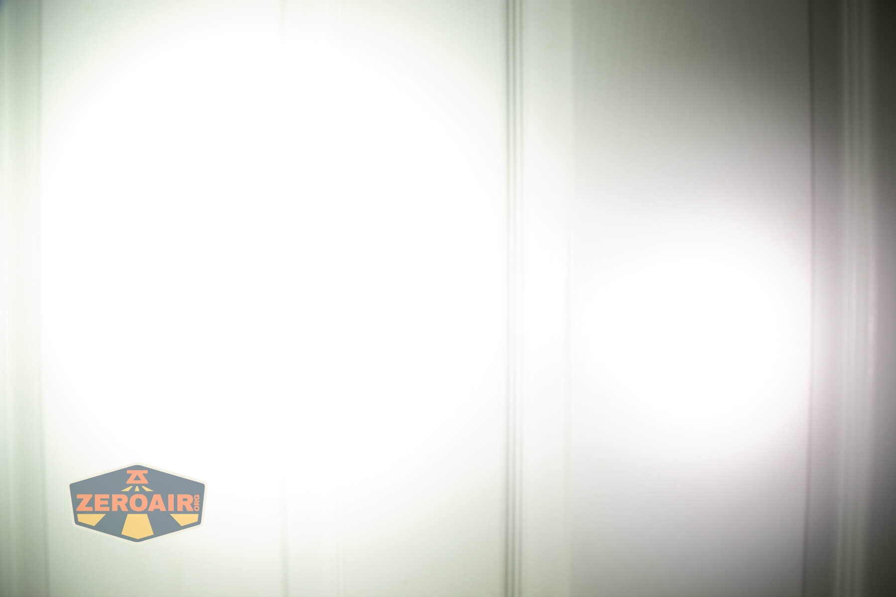 Trustfire Mini X3 Pro EDC multi-function flashlight beamshots on door (at 1') compared to nichia 219b 4500K