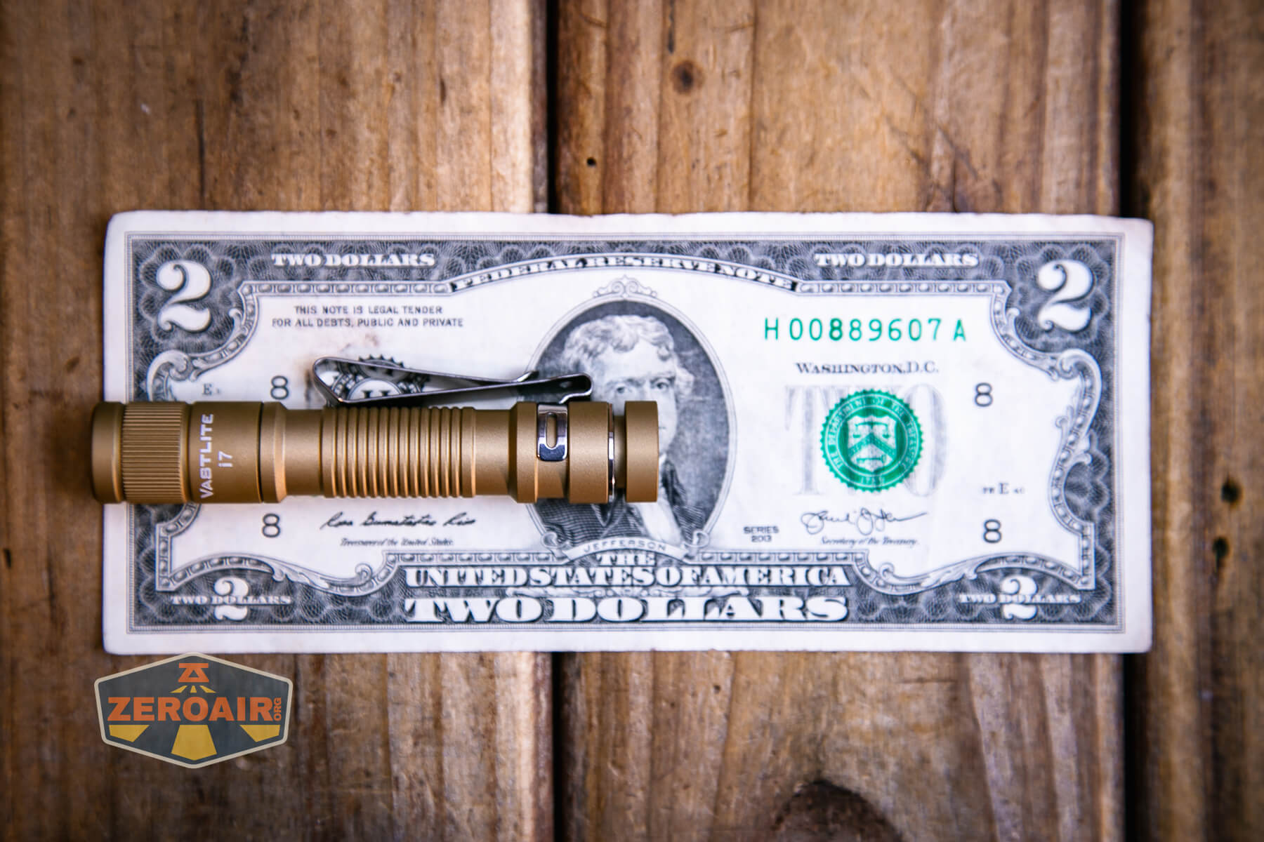 Vastlite i7 10440 flashlight on a two dollar bill