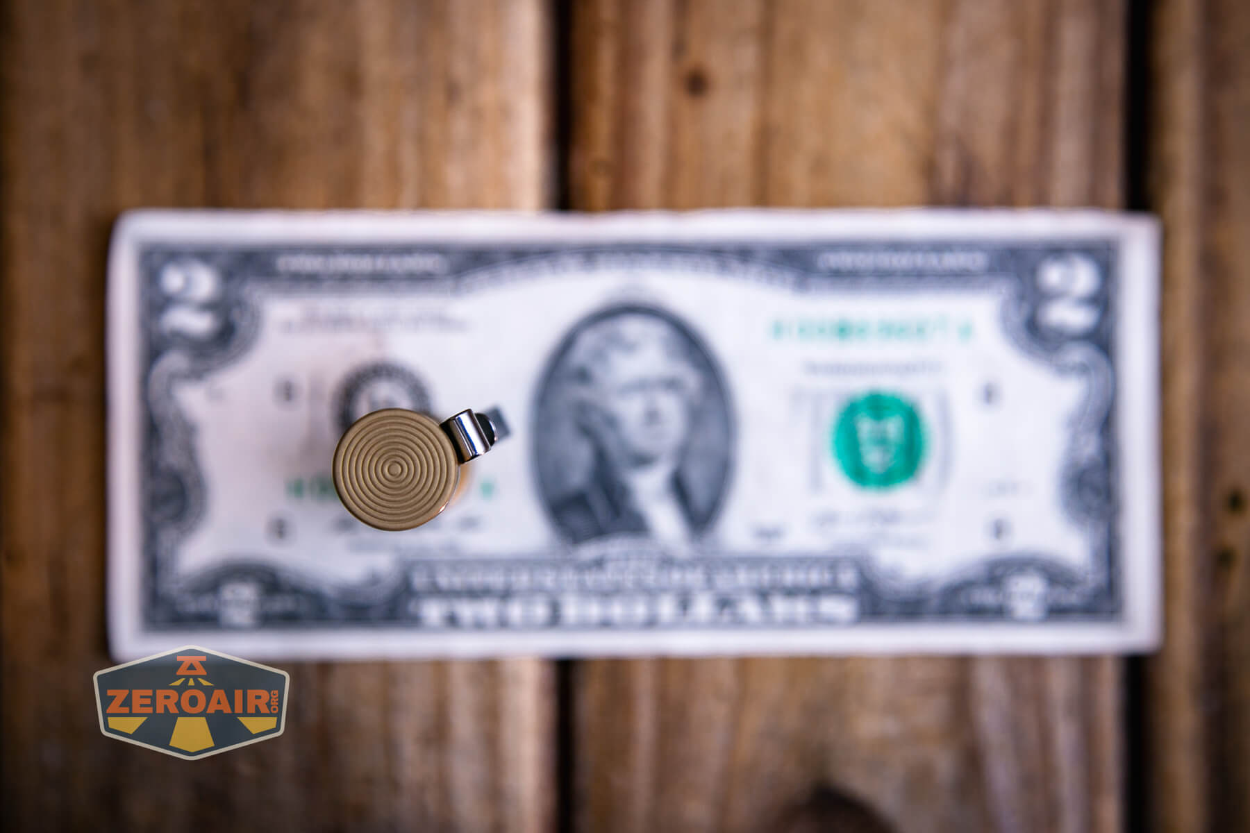 Vastlite i7 10440 flashlight on a two dollar bill