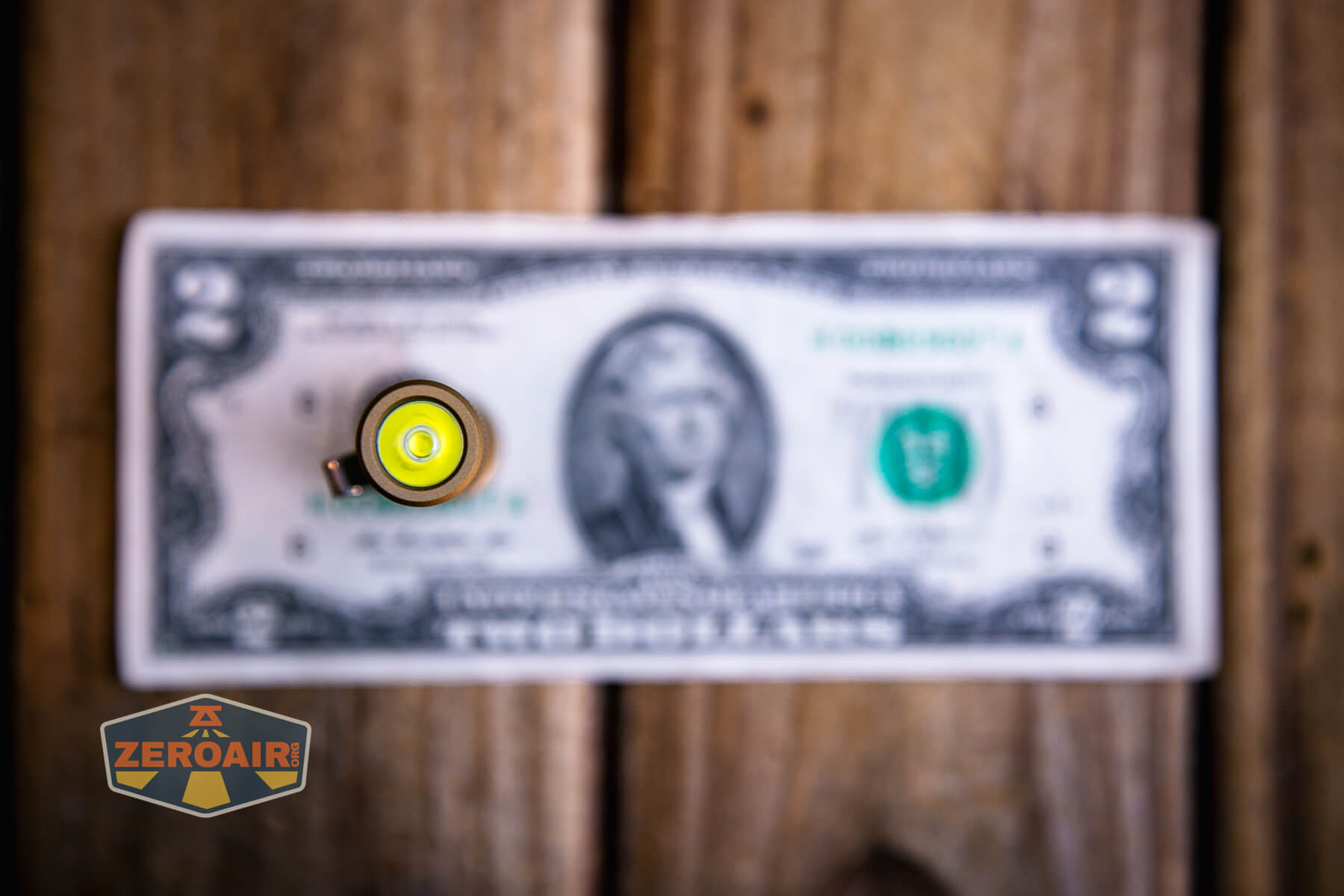 Vastlite i7 10440 flashlight on a two dollar bill