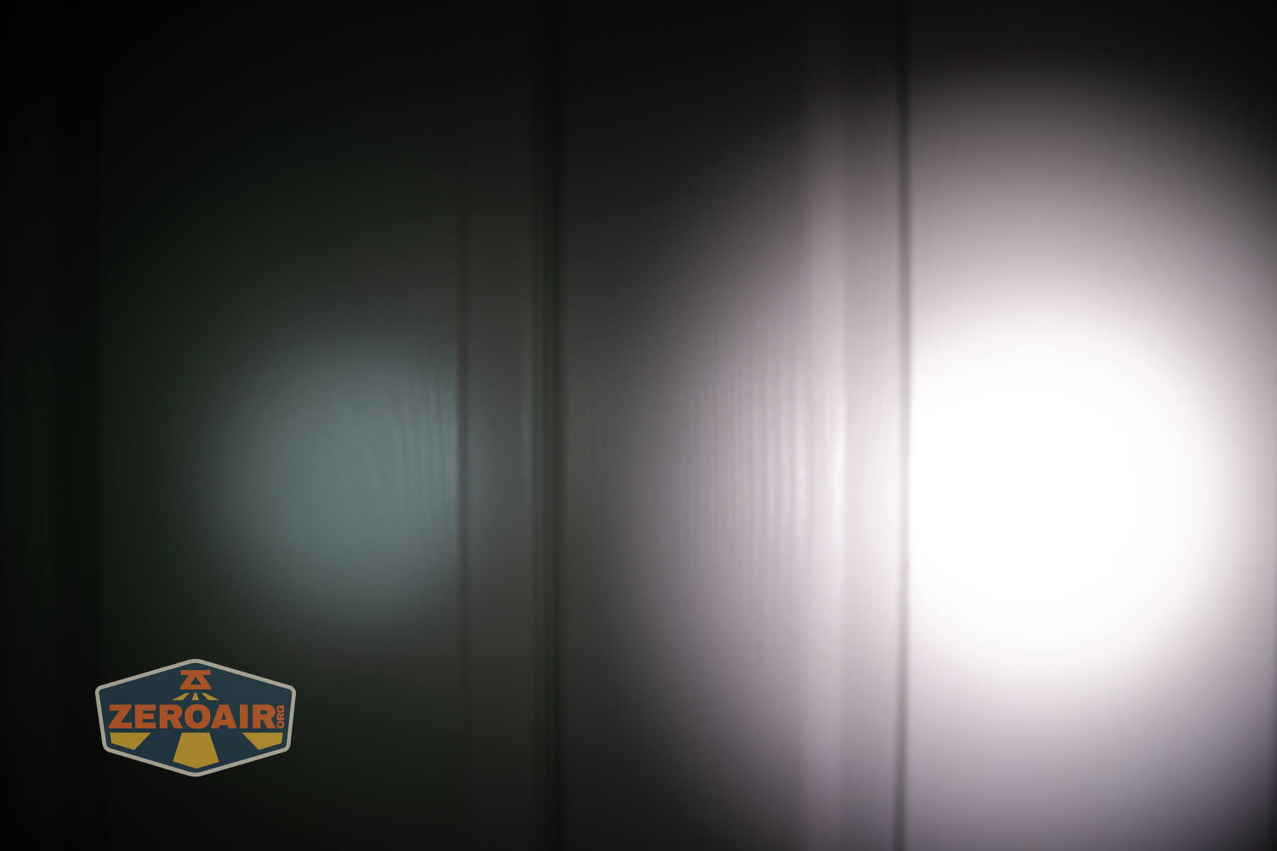 Vastlite i7 10440 flashlight beamshots on door (at 1') compared to nichia 219b 4500K