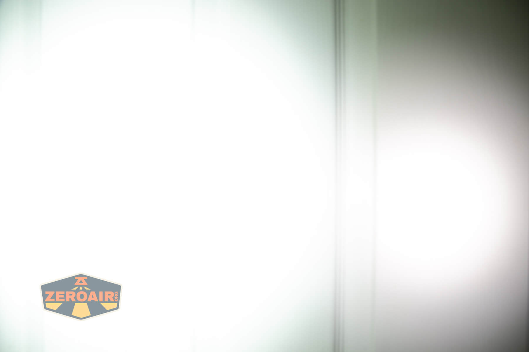 Vastlite i7 10440 flashlight beamshots on door (at 1') compared to nichia 219b 4500K