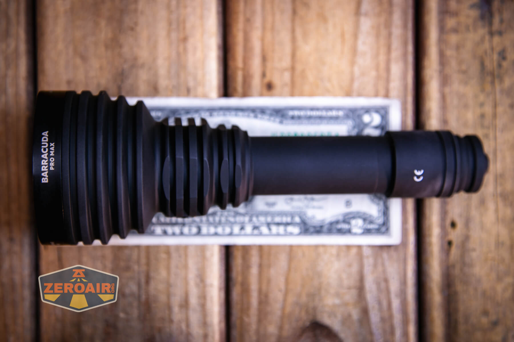 Armytek Barracuda Pro Max searchlight on two dollar bill