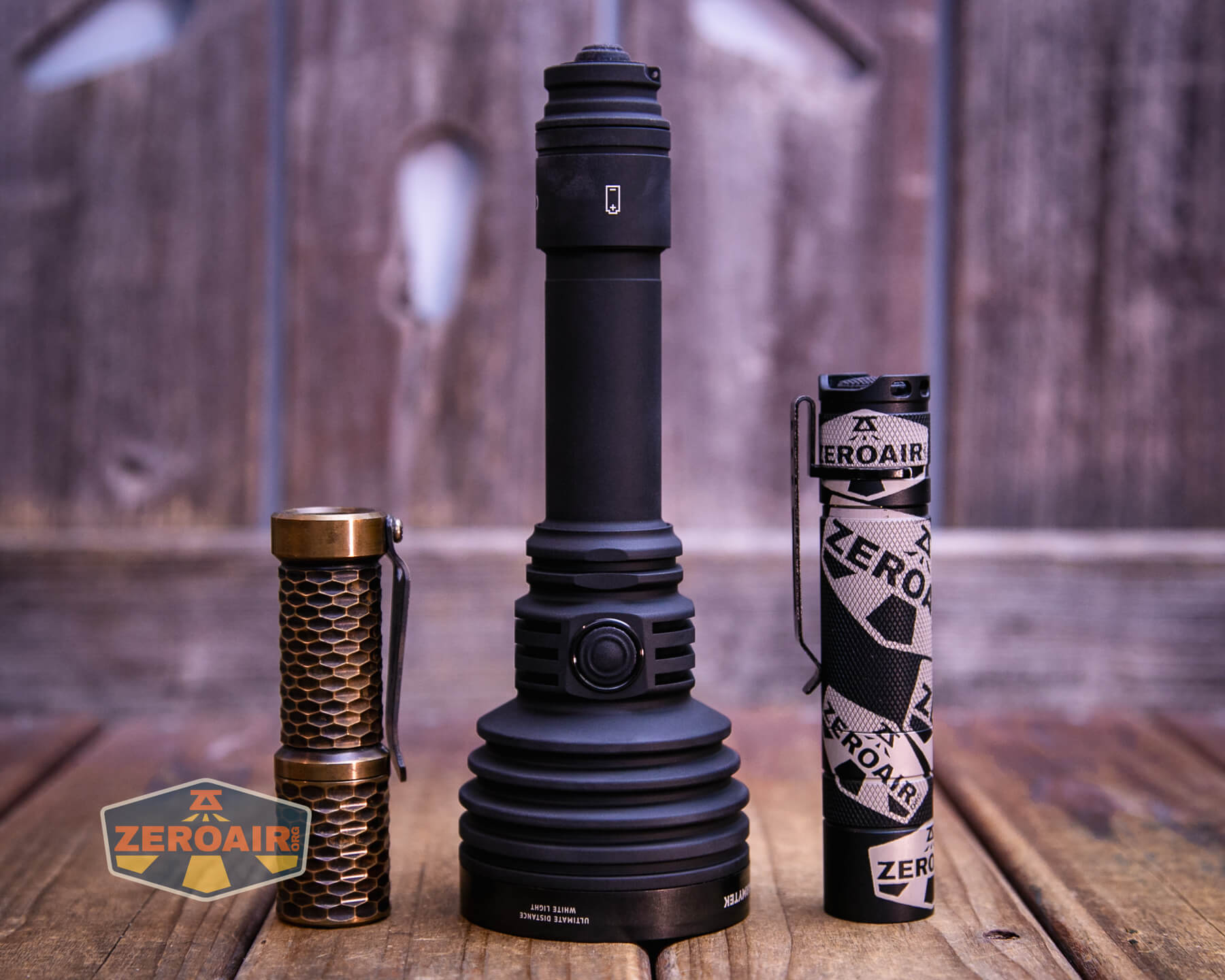 Armytek Barracuda Pro Max searchlight with standard sized flashlights