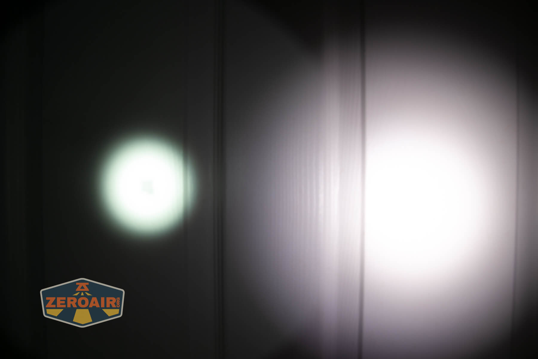 Armytek Barracuda Pro Max searchlight beamshots on door compared to nichia 219b