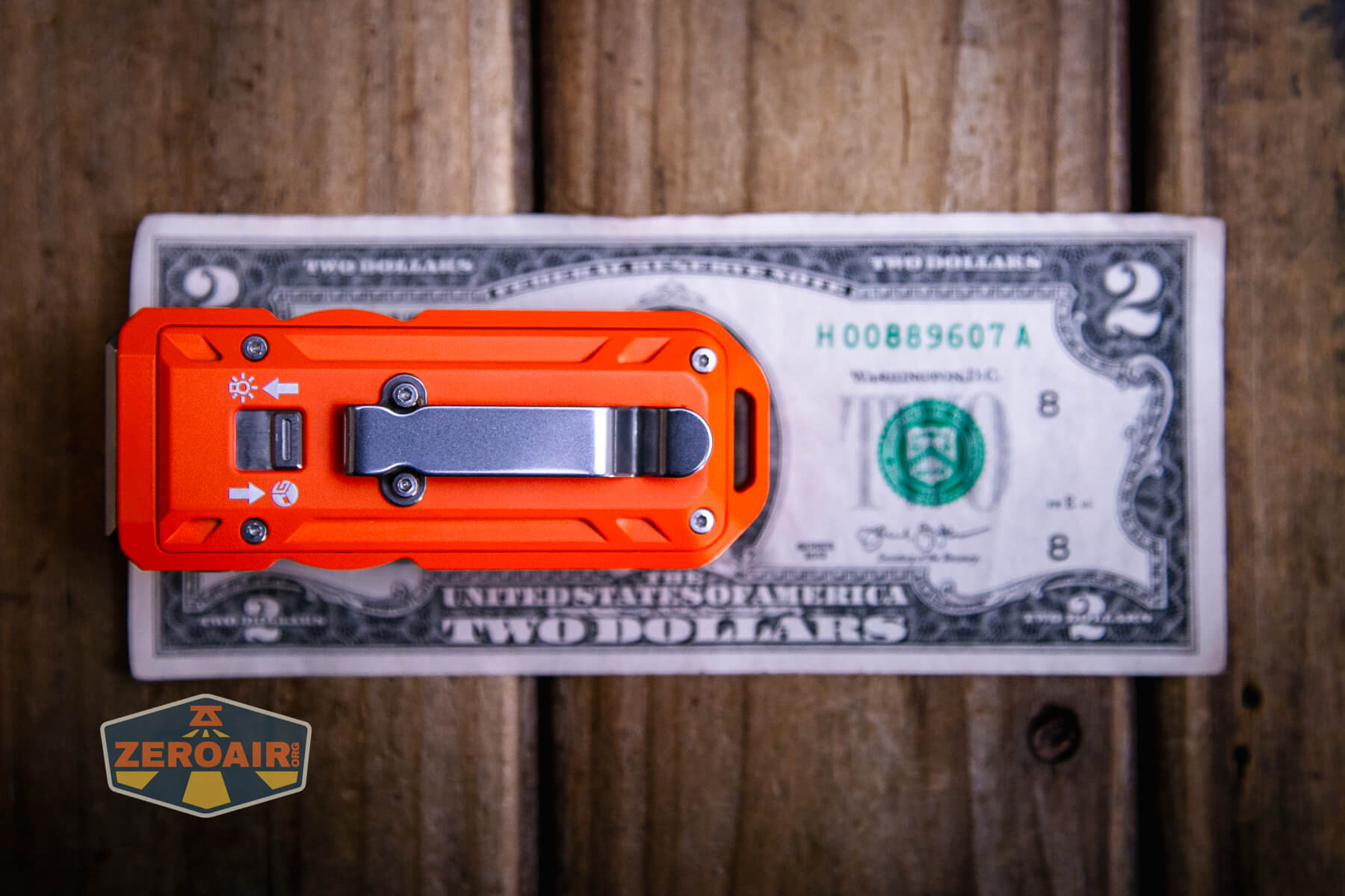 Mateminco TACUBE 3.0 multi-function RGB flashlight on a two dollar bill