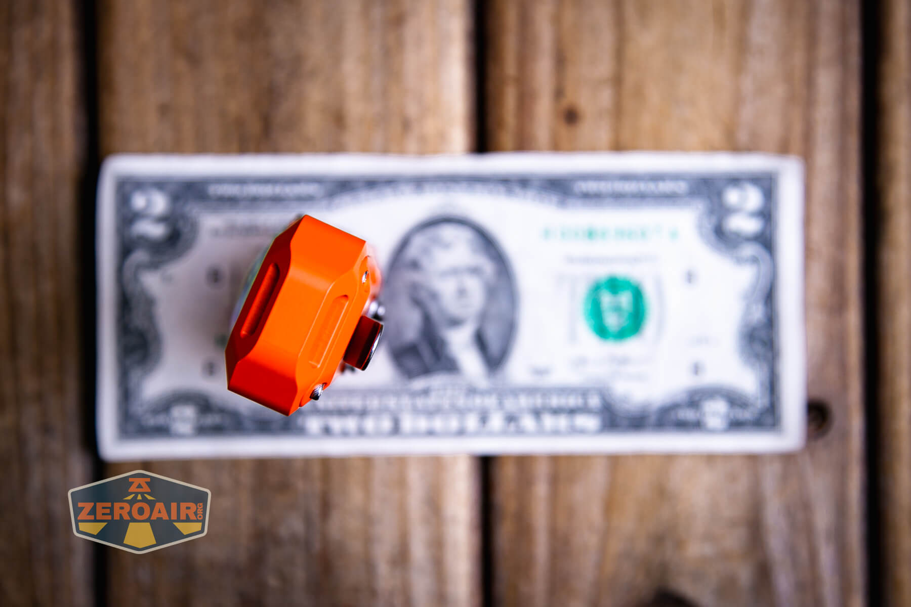 Mateminco TACUBE 3.0 multi-function RGB flashlight on a two dollar bill