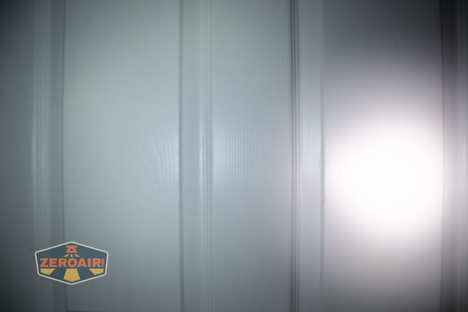 Mateminco TACUBE 3.0 multi-function RGB flashlight beamshots on door (at 1') compared to nichia 219b 4500K