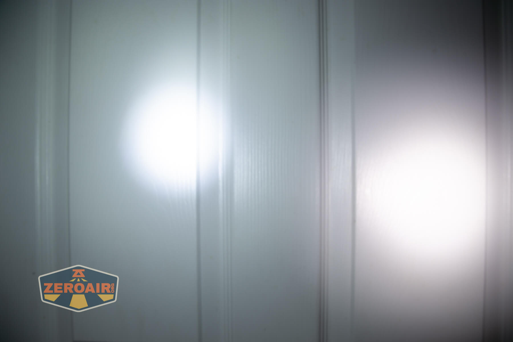 Mateminco TACUBE 3.0 multi-function RGB flashlight beamshots on door (at 1') compared to nichia 219b 4500K