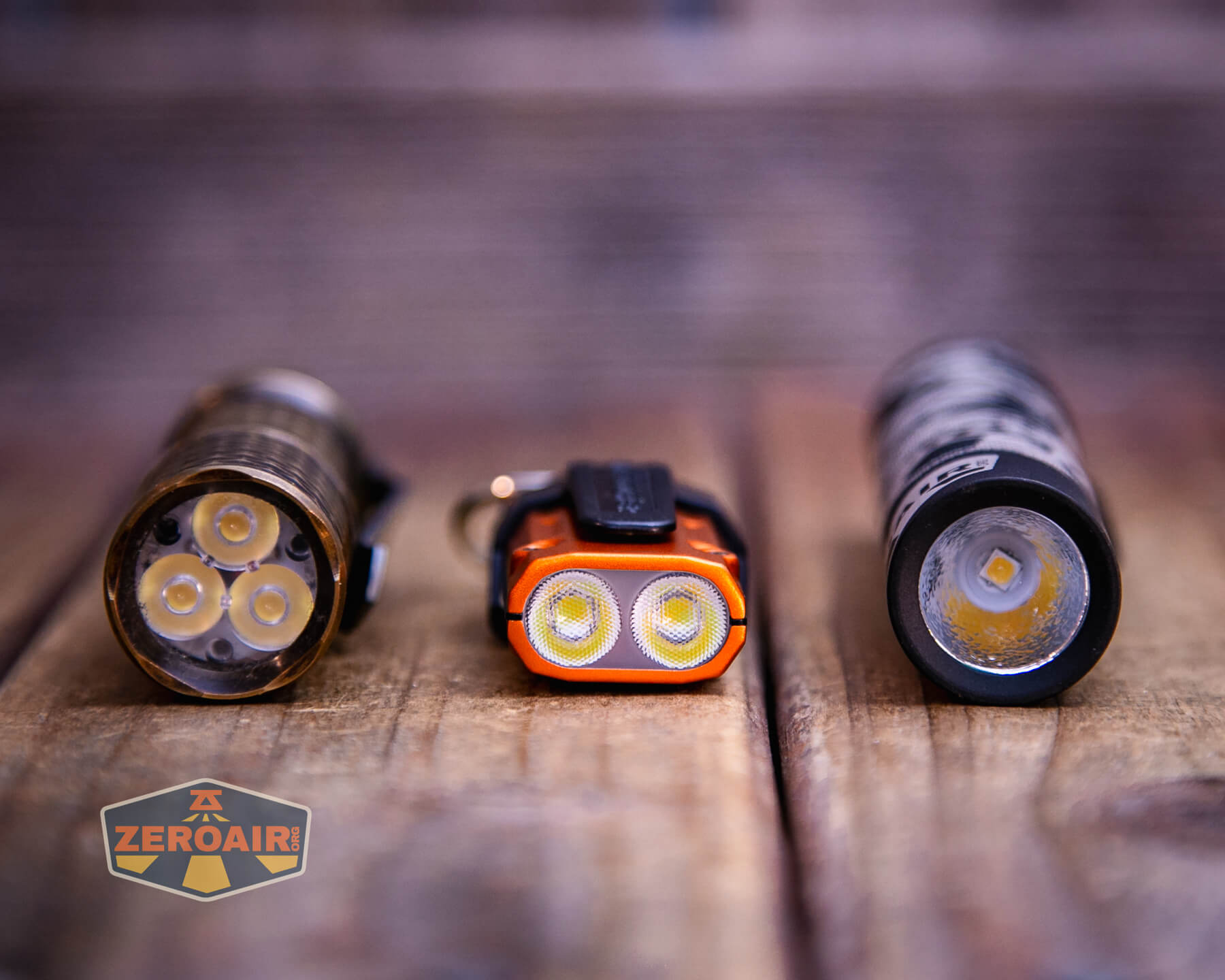 Nitecore TIP3 keychain flashlight with two standard sized flashlights