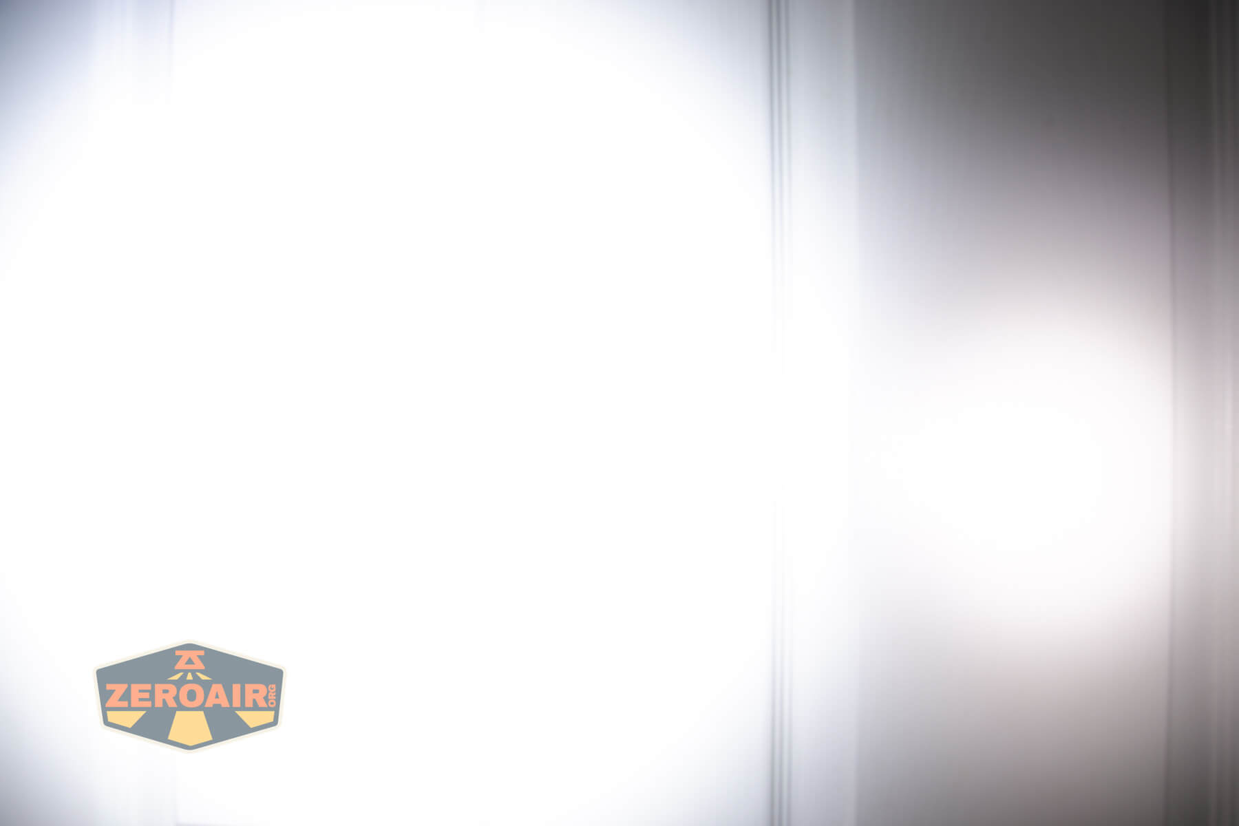 Nitecore TIP3 keychain flashlight beamshots on door (at 1') compared to nichia 219b 4500K