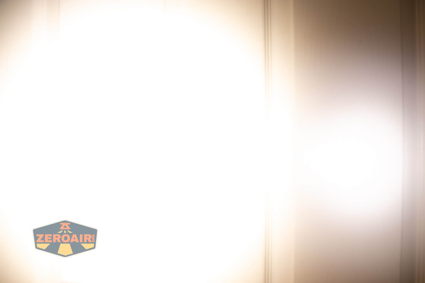 Nitecore TIP3 keychain flashlight beamshots on door (at 1') compared to nichia 219b 4500K