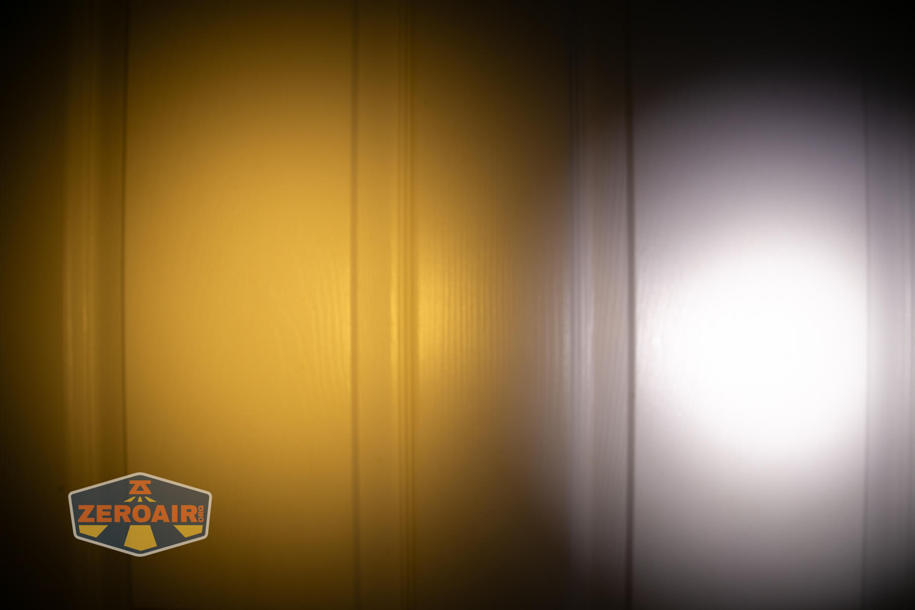 Nitecore TIP3 keychain flashlight beamshots on door (at 1') compared to nichia 219b 4500K