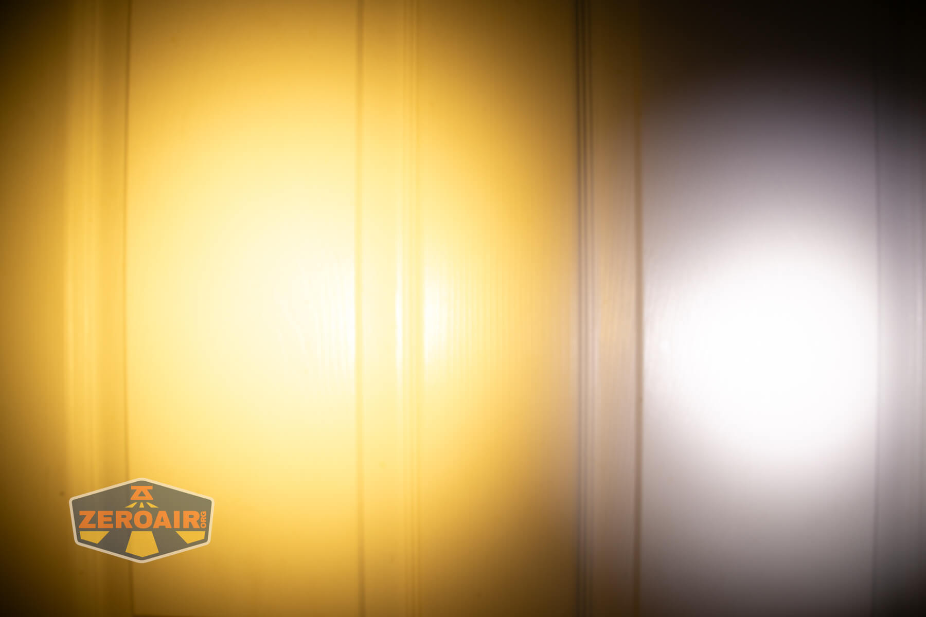 Nitecore TIP3 keychain flashlight beamshots on door (at 1') compared to nichia 219b 4500K