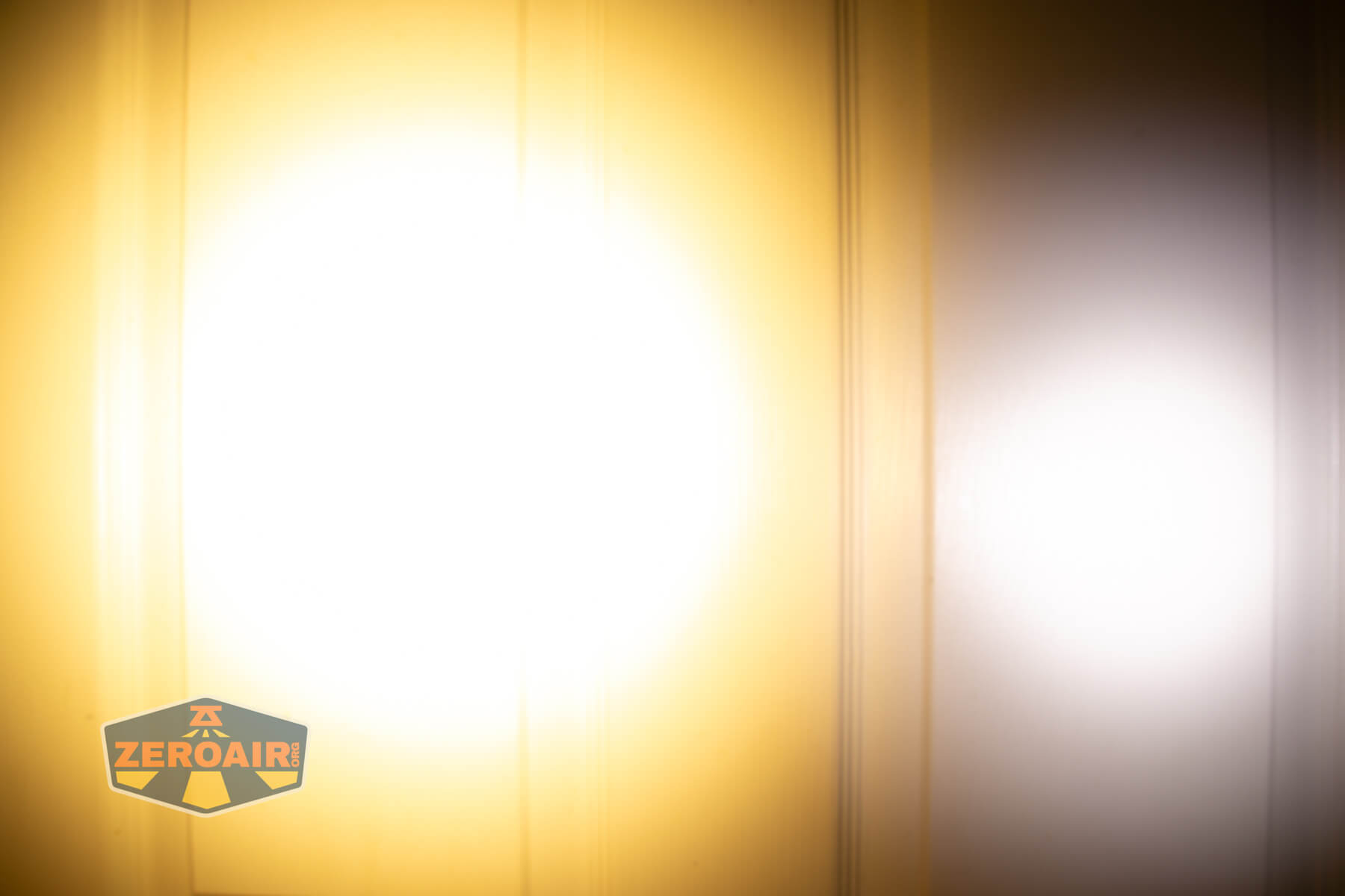 Nitecore TIP3 keychain flashlight beamshots on door (at 1') compared to nichia 219b 4500K