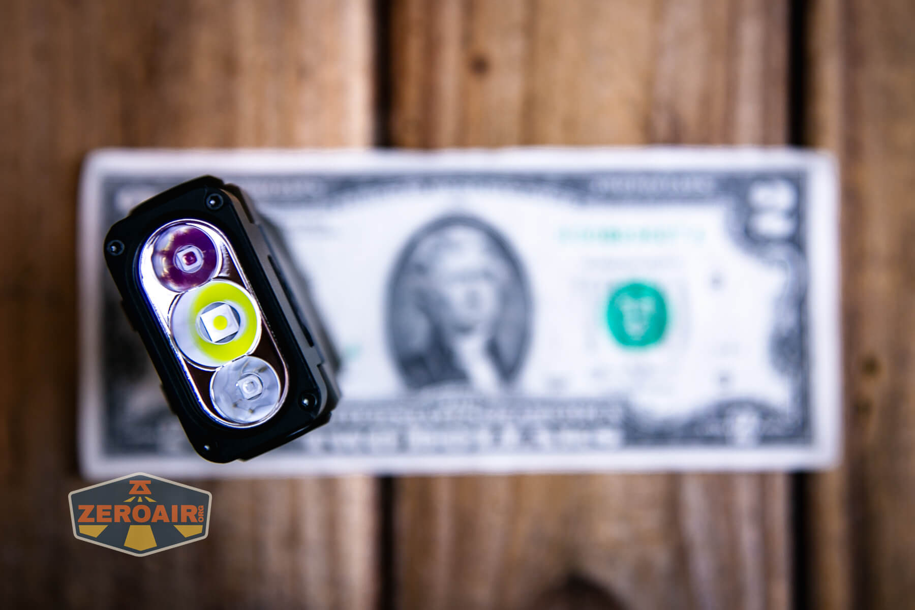 Sofirn ST2 multi-function flat flashlight on a two dollar bill