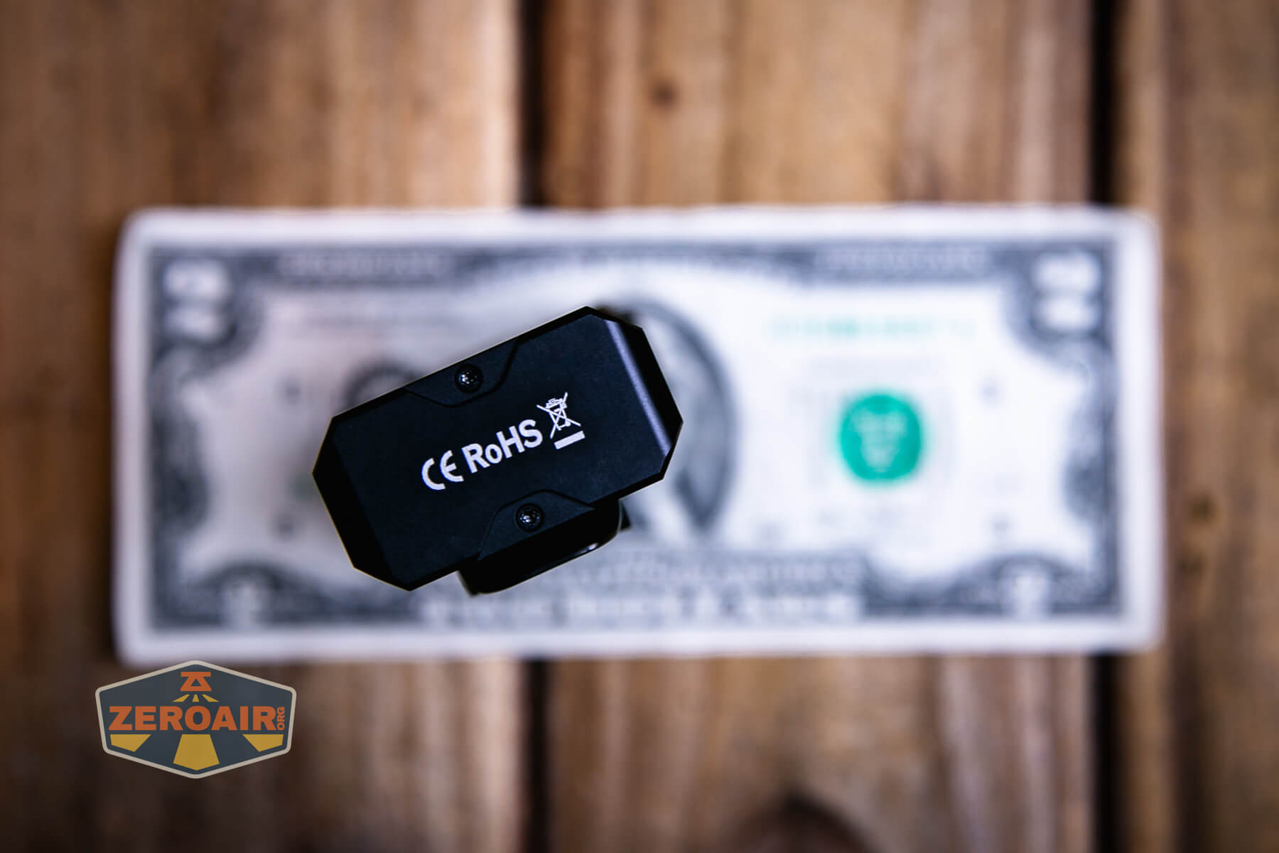 Sofirn ST2 multi-function flat flashlight on a two dollar bill